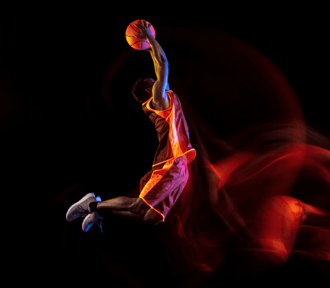 a man dunking with vibrant lights