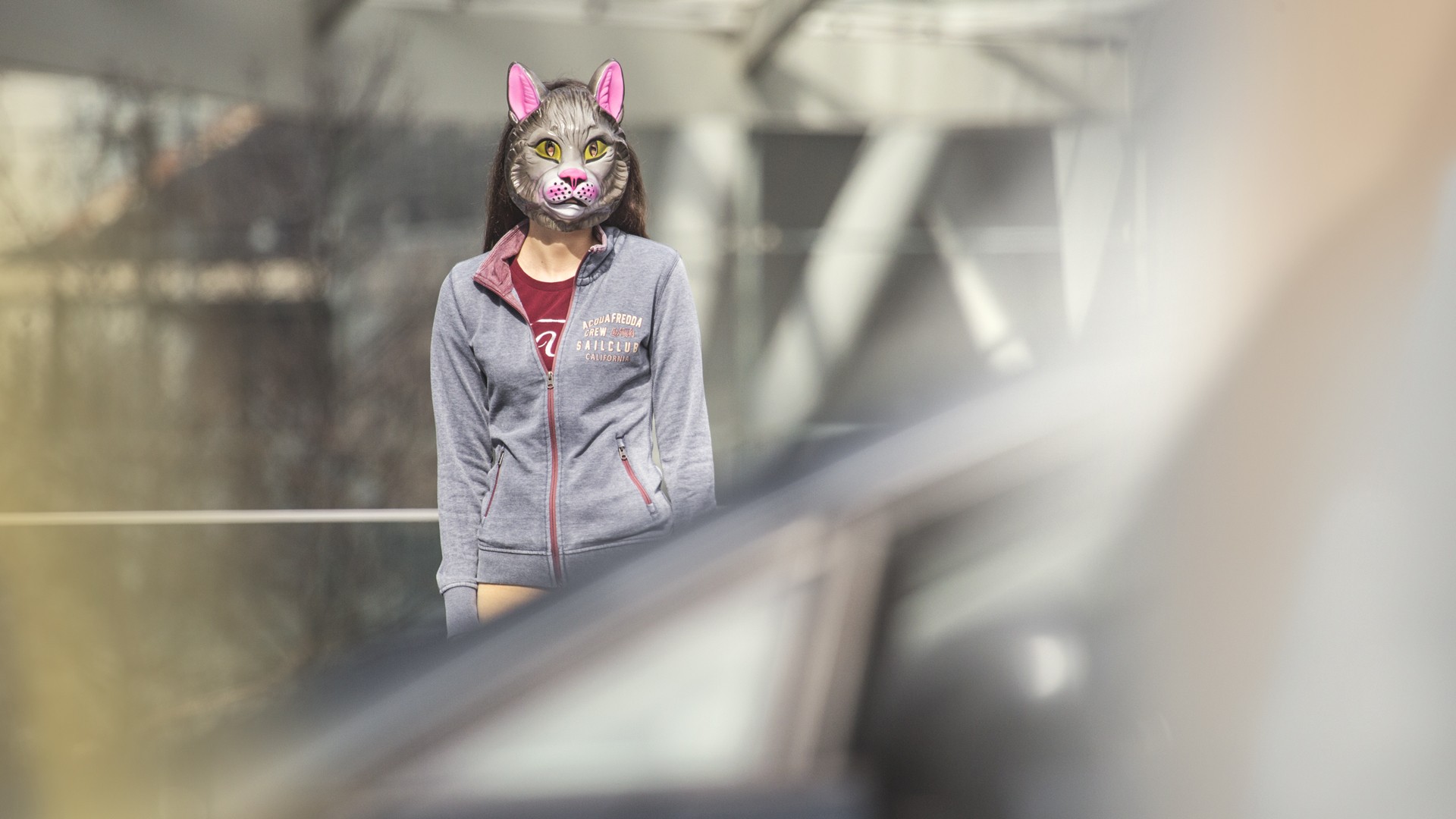 Stack of modern books and magazine with minimalist cover design on leather chair