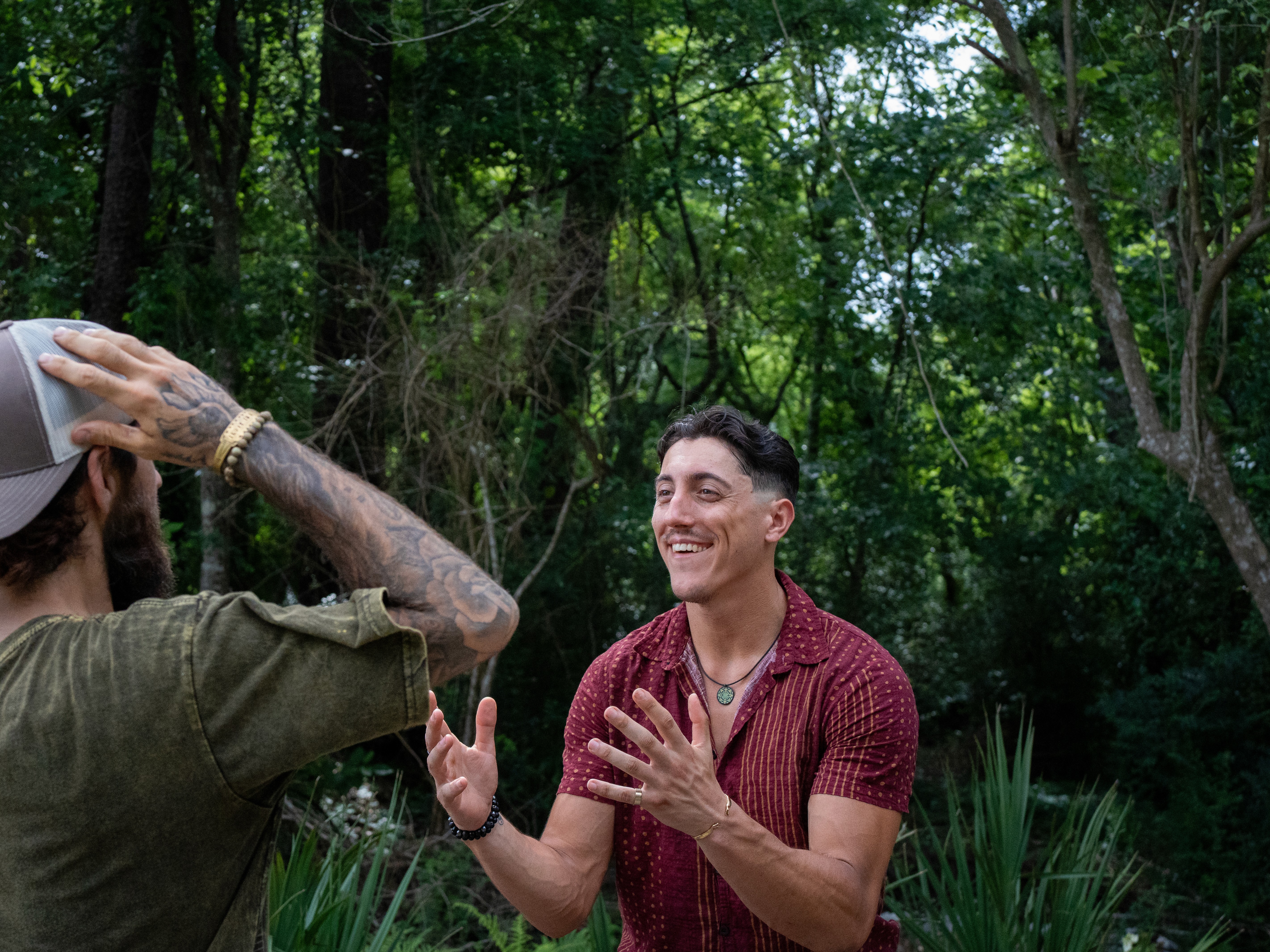 Reese LeBlanc laughing in outdoor conversation