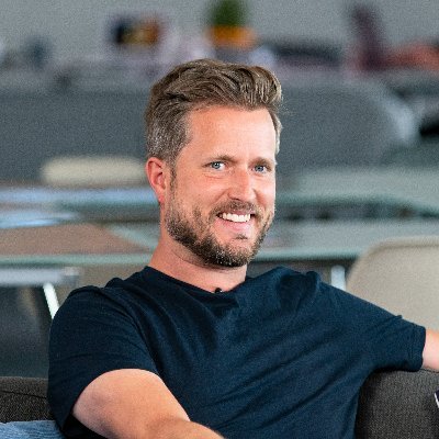 Hero image featuring a greyscaled communication platform on an abstract background.