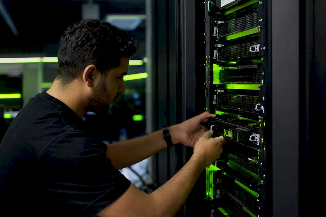 Hands adjusting multiplayer game server hardware