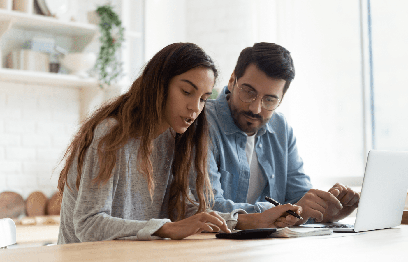 Serious wife and husband planning budget, checking finances