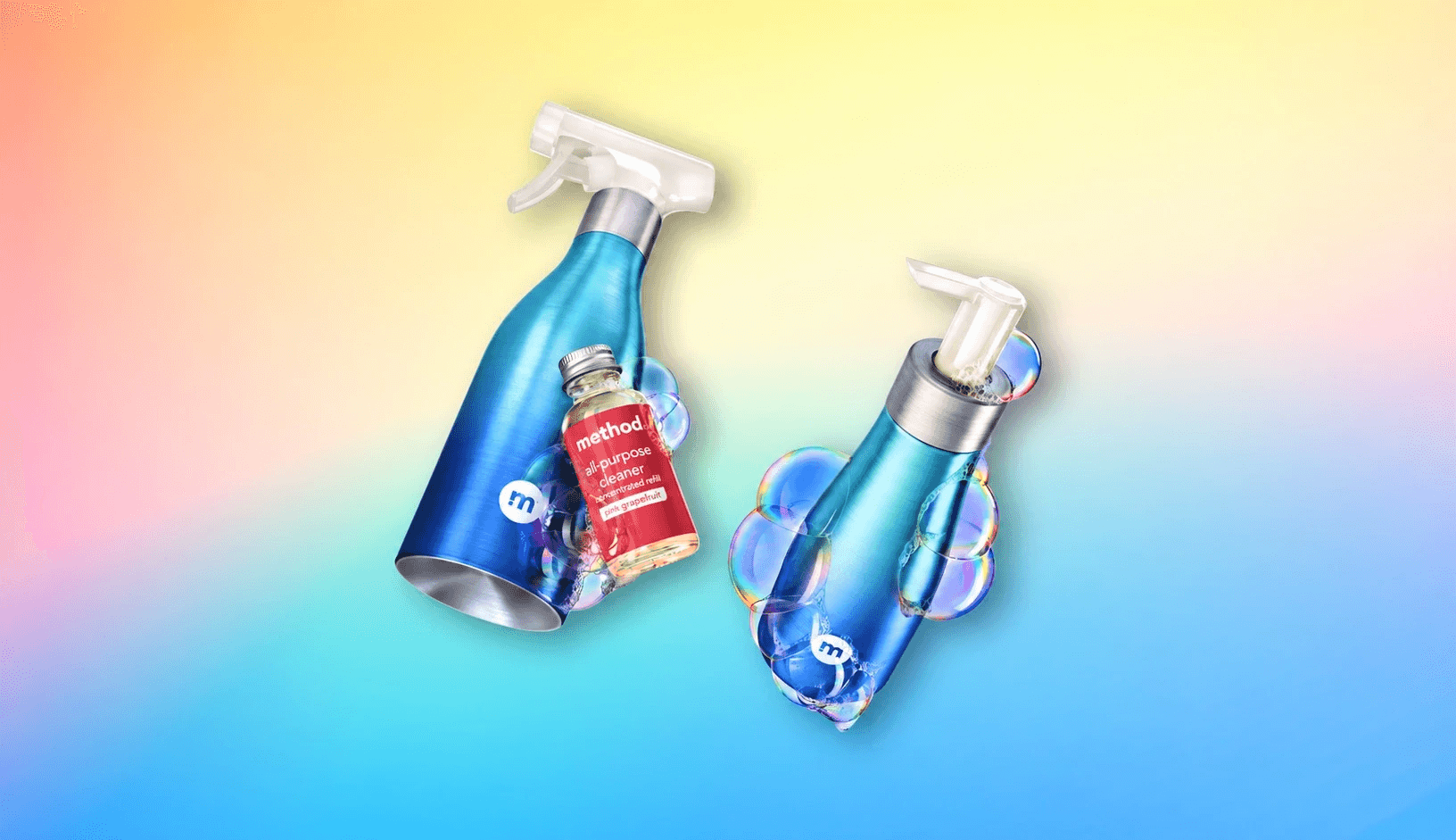 Blue aluminum spray bottle and pump bottle floating with soap bubbles and a small refill vial against a rainbow gradient