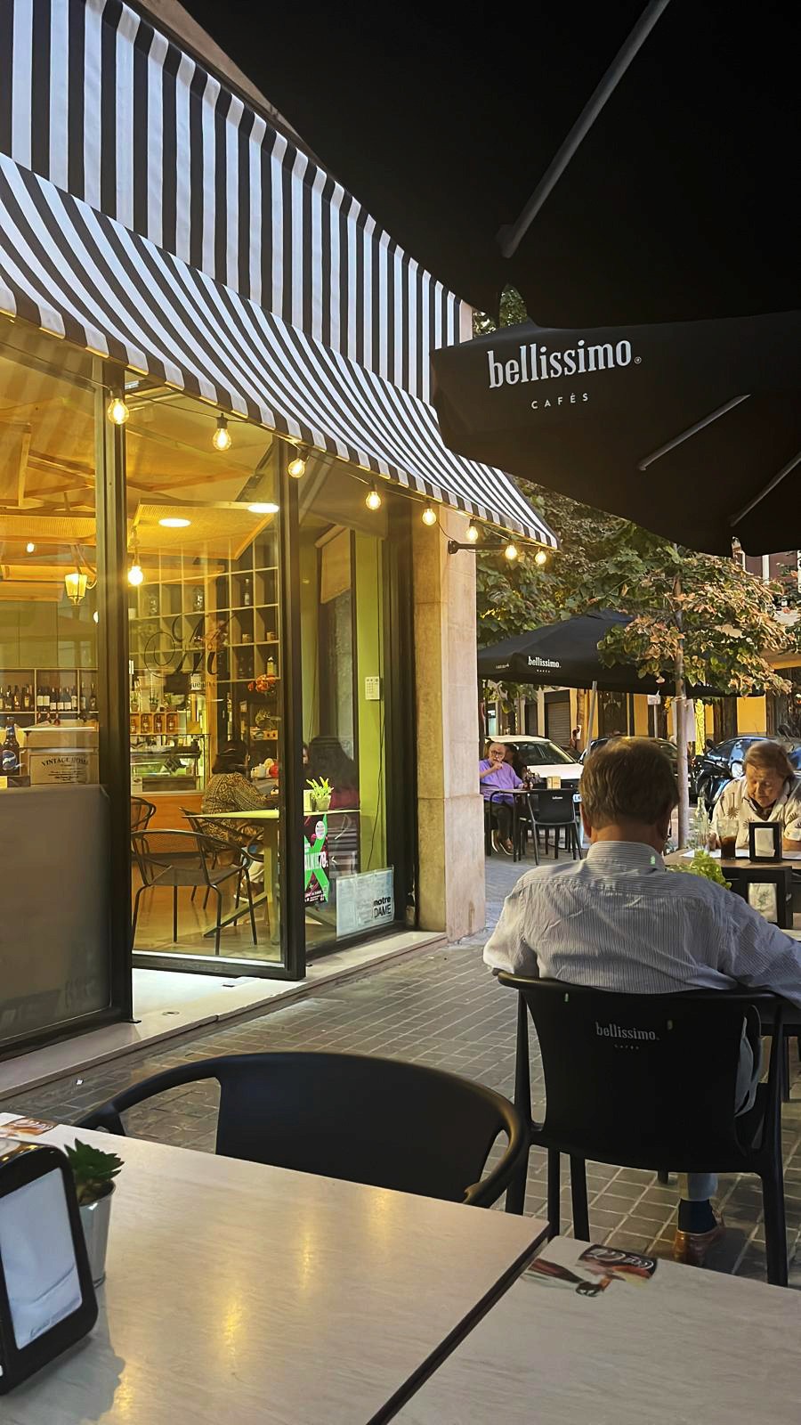 Waiter holding pizza boxes