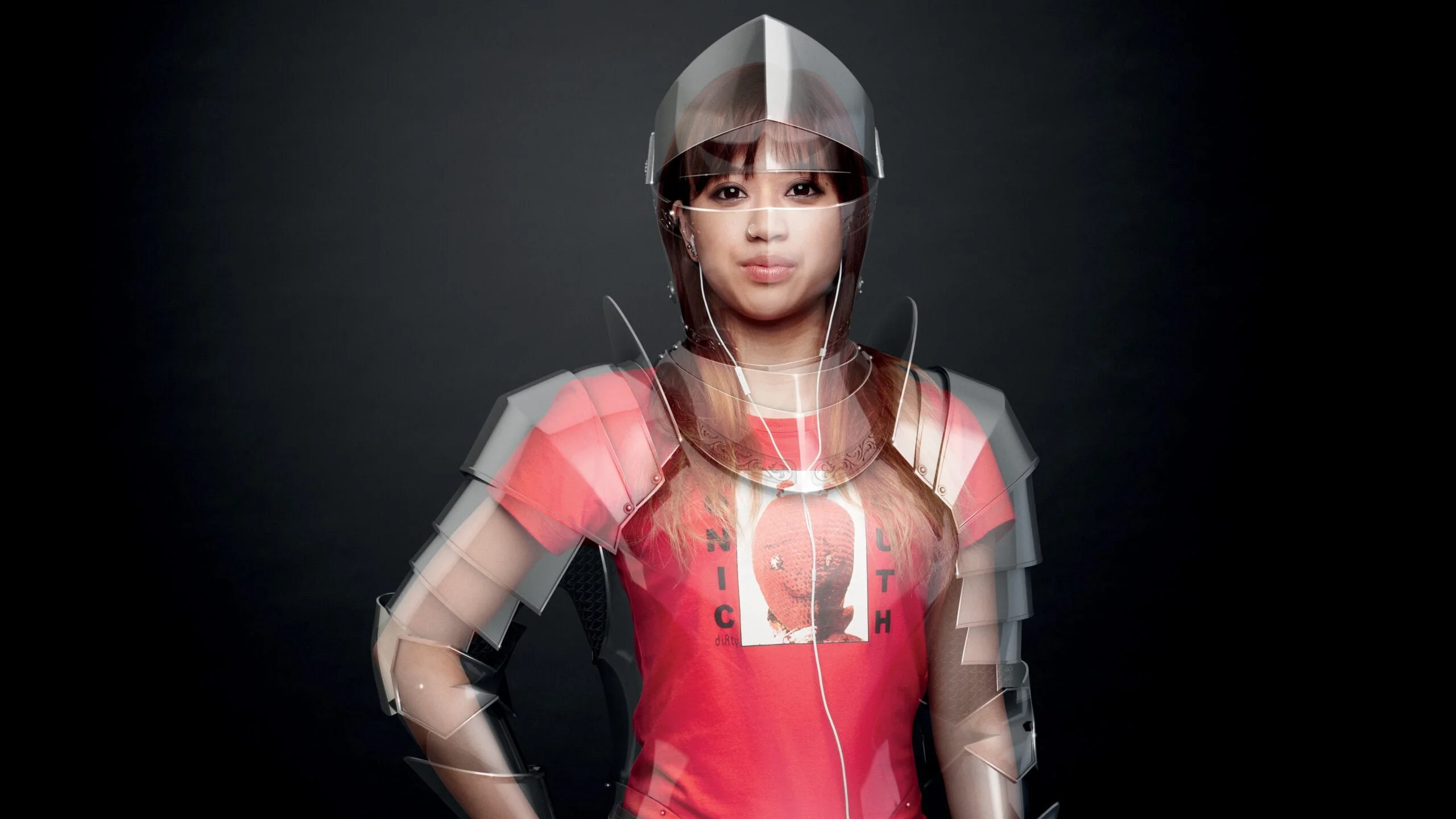 Young woman in a red T-shirt and translucent armour on a dark background, from the 'Protecting us all' human rights campaign