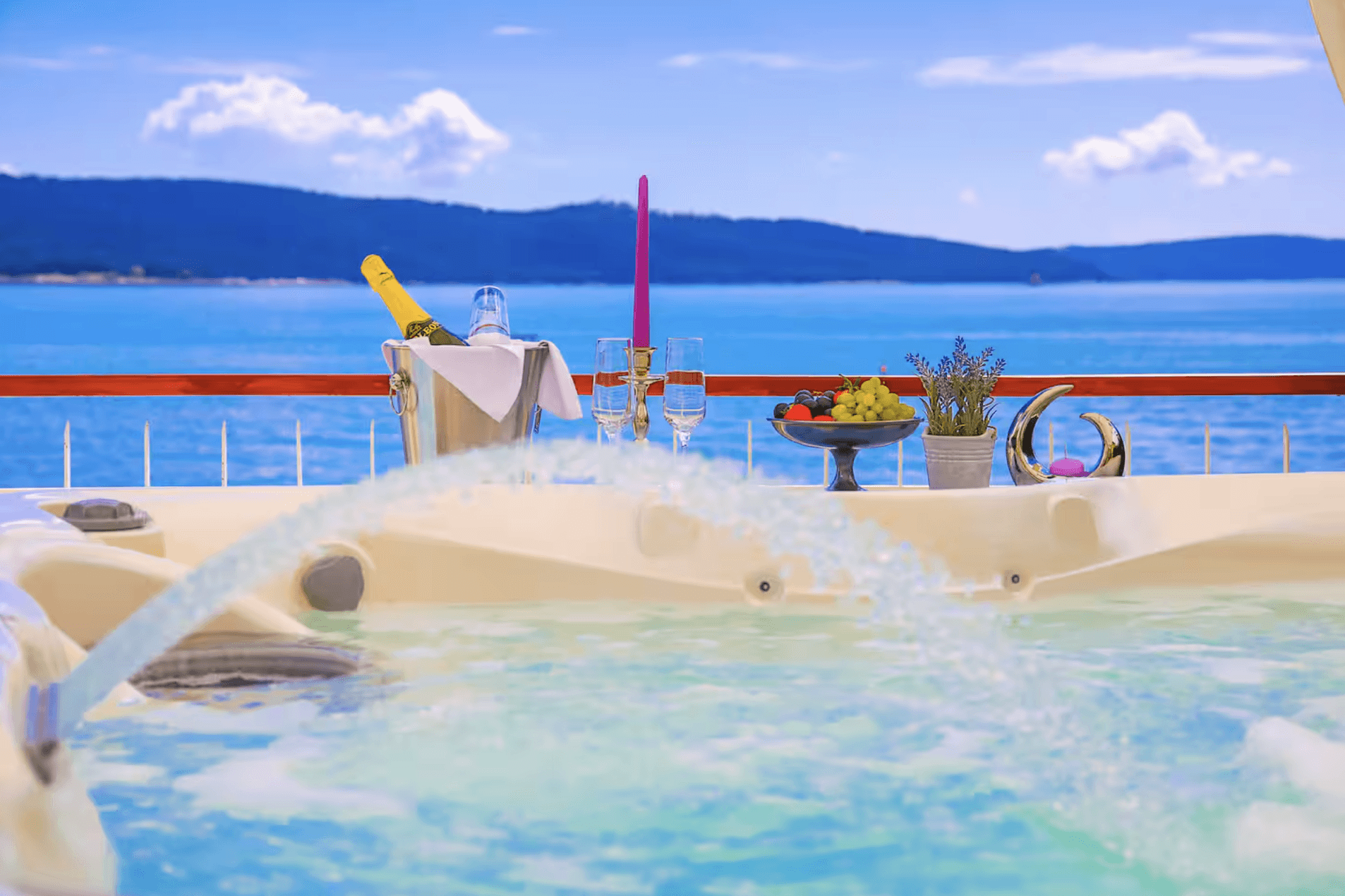 Black sports car in front of a modern, futuristic curved building.
