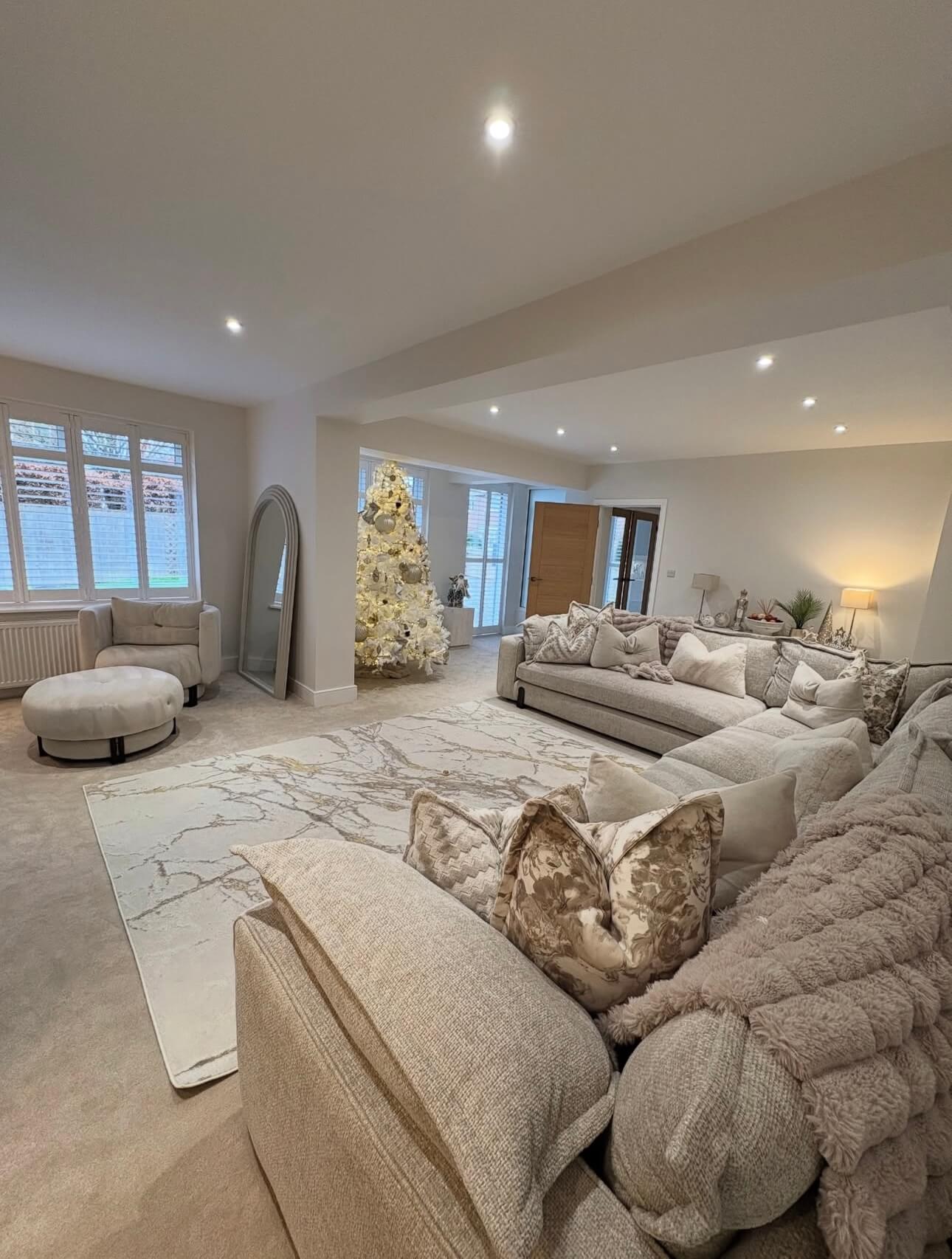 A large, professionally cleaned living room after a recurring home cleaning service.