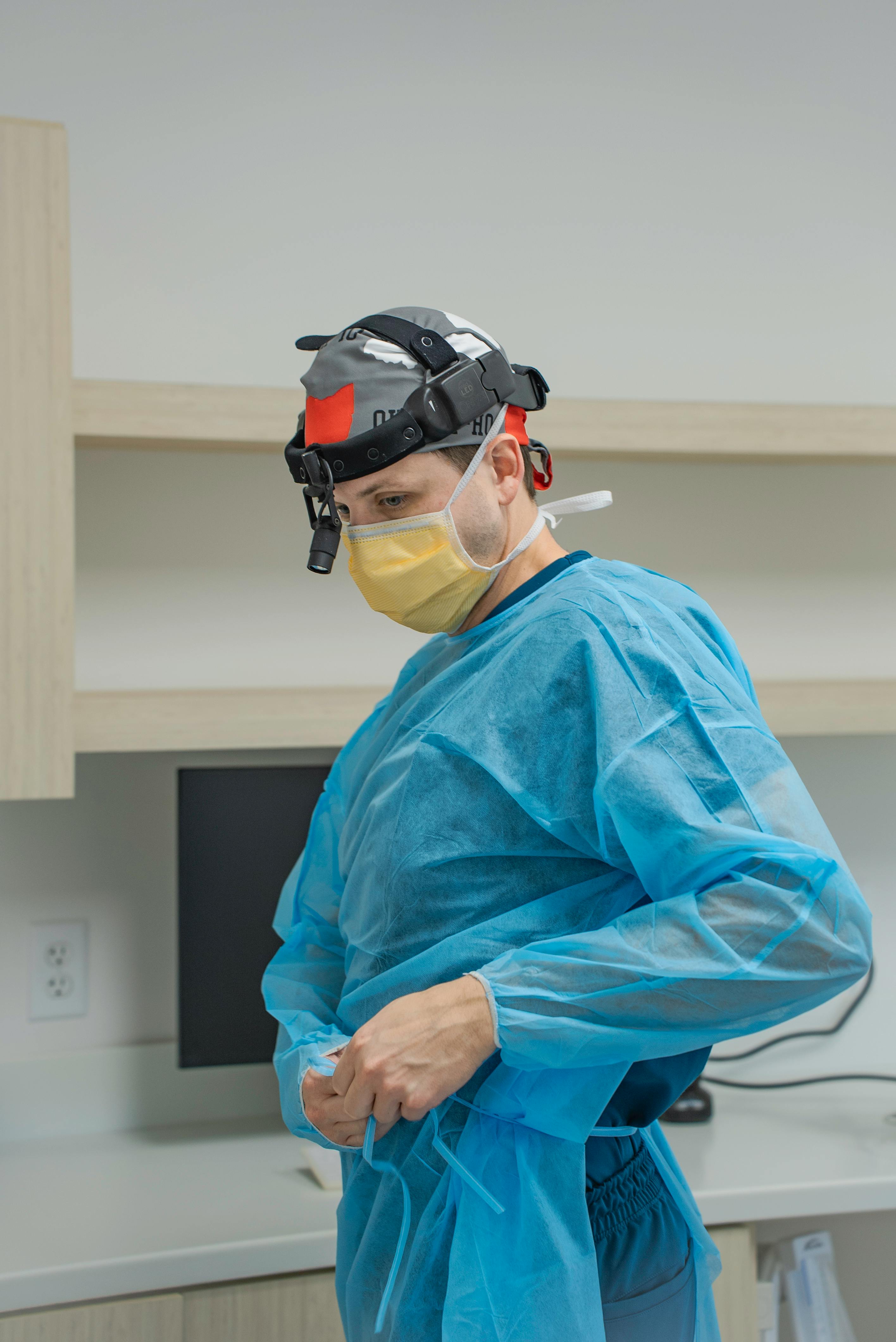 A doctor discusses an ECG result with a patient in a medical office, emphasizing a professional and attentive healthcare setting.