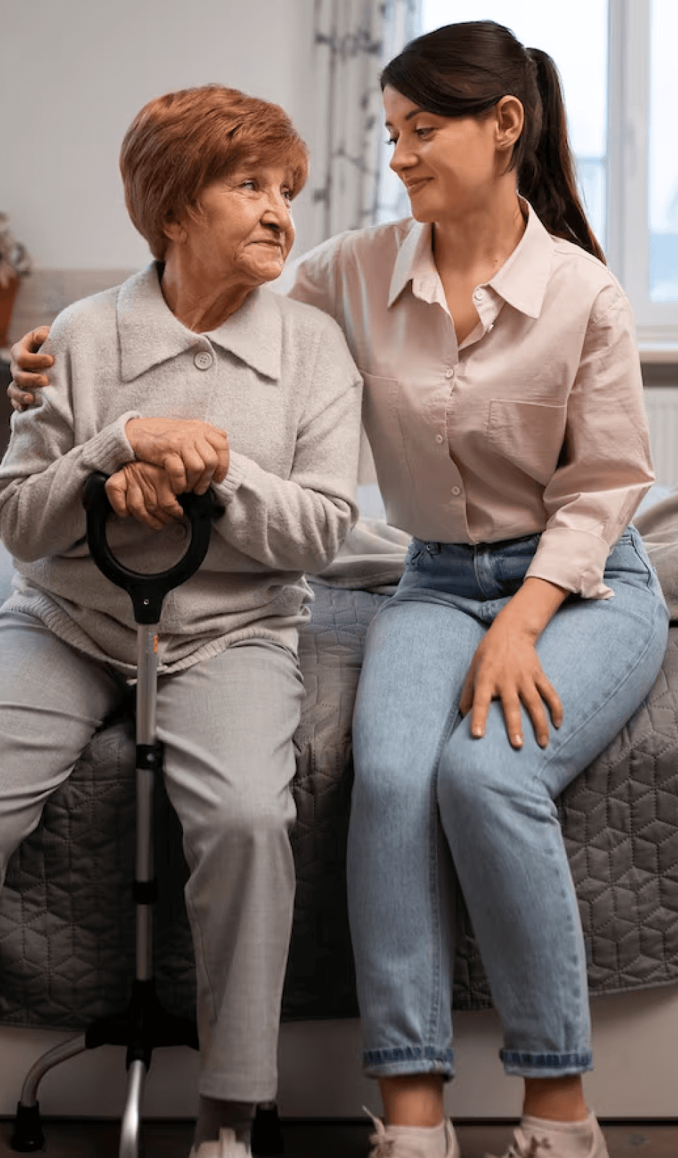 a woman sitting with her grandmother