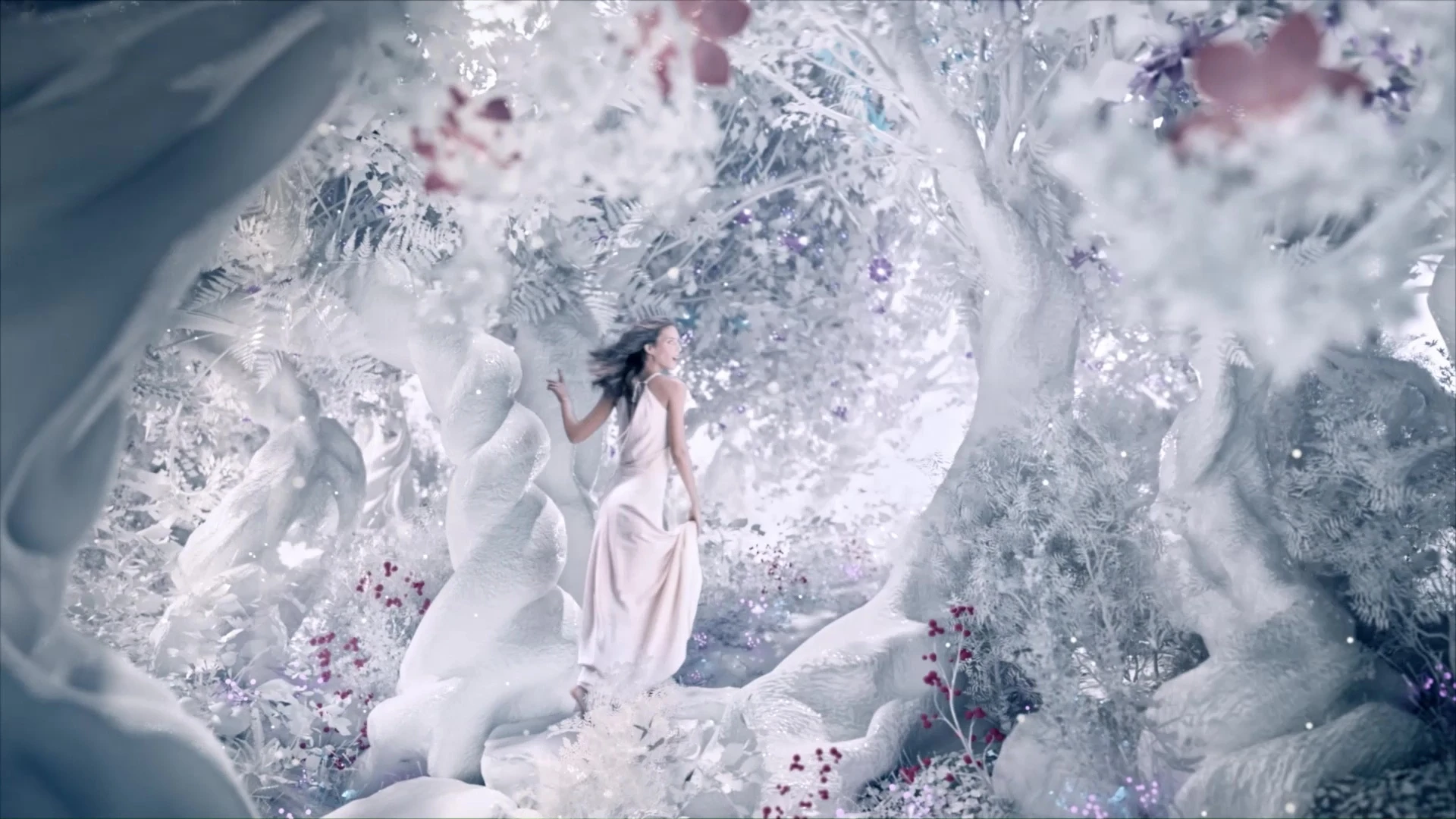 Woman passing between trees in a fantastical white porcelain forest