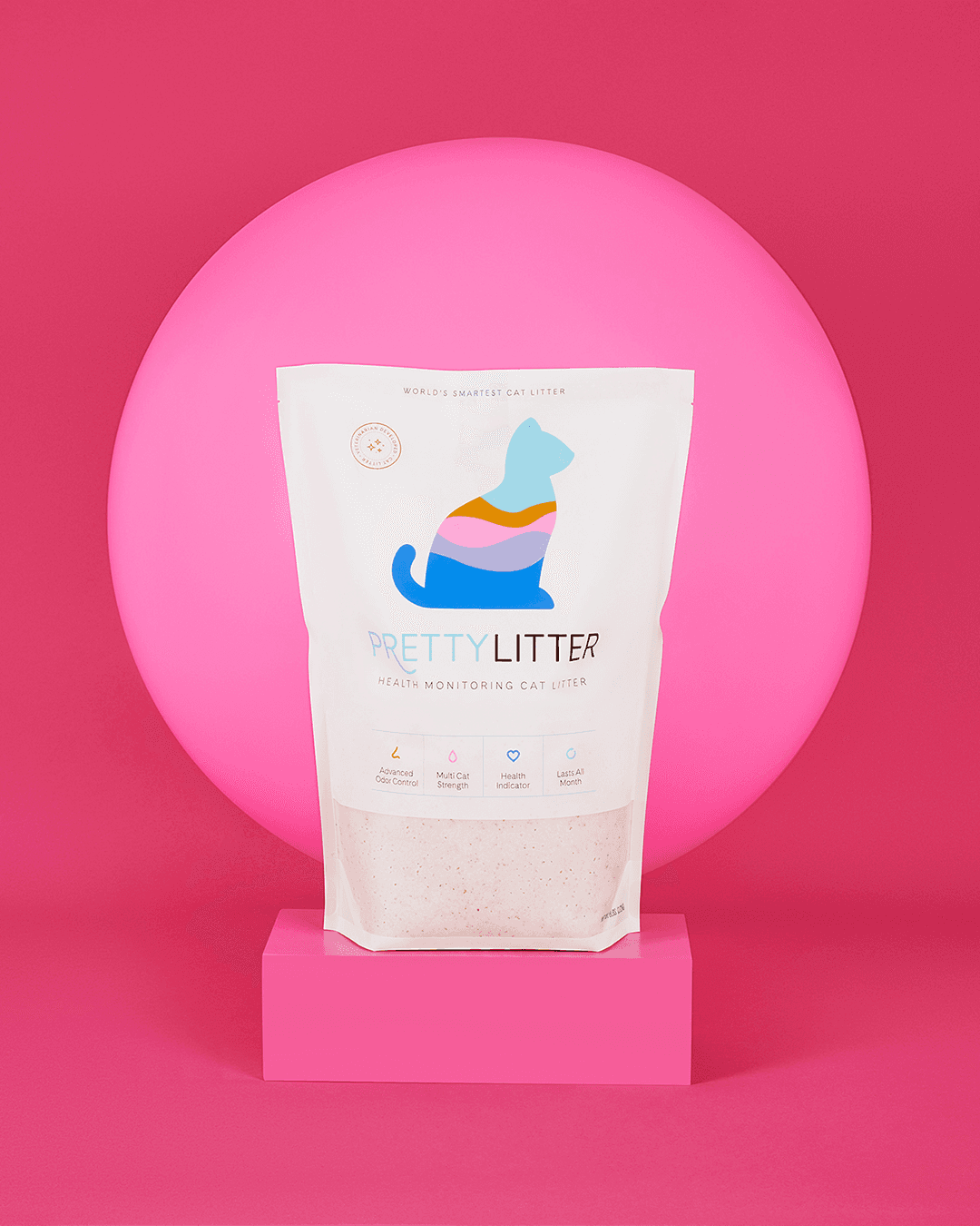 PrettyLitter product packaging in front of a bubble-gum pink backdrop