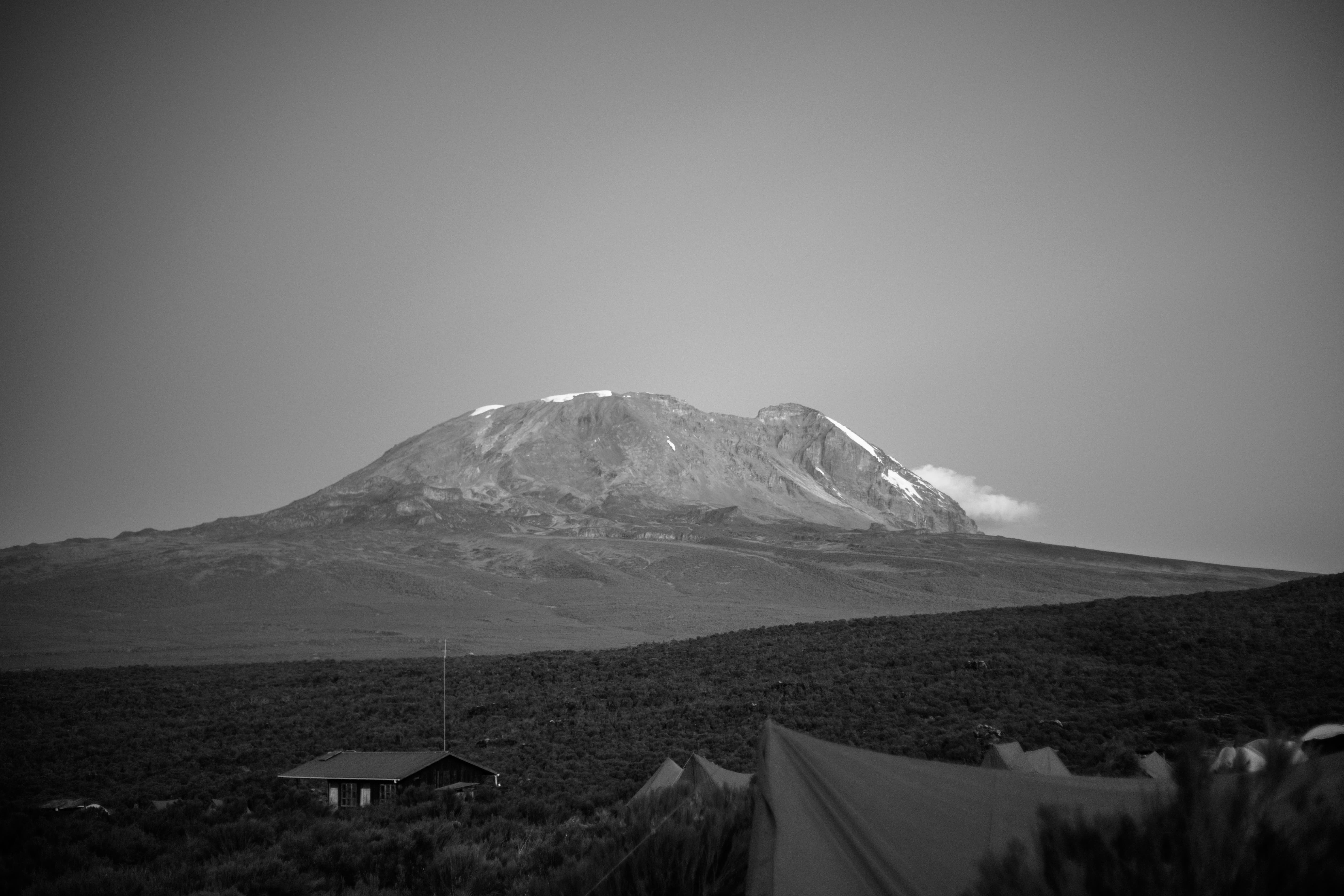 Mount Kilimanjaro rising above the cloud line in clear dry-season conditions, showing the best time to climb Kilimanjaro.