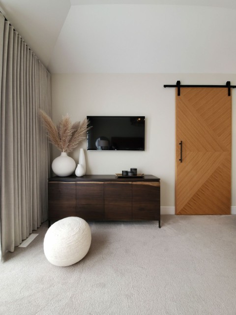 Image of Luxury interior design featuring KHD Homes' stylish furniture, layout design, and window coverings in a renovated space.