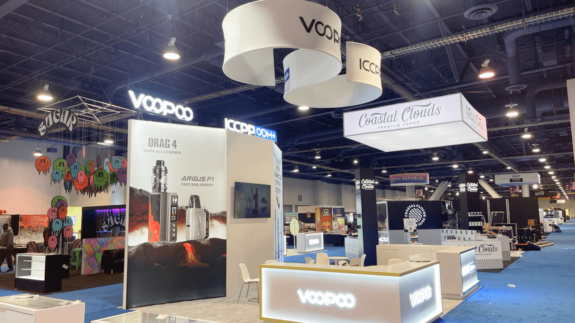 Tobacco and vapor display booth at Las Vegas Convention Center arranged with countertop merchandising and category shelving for wholesale conversations