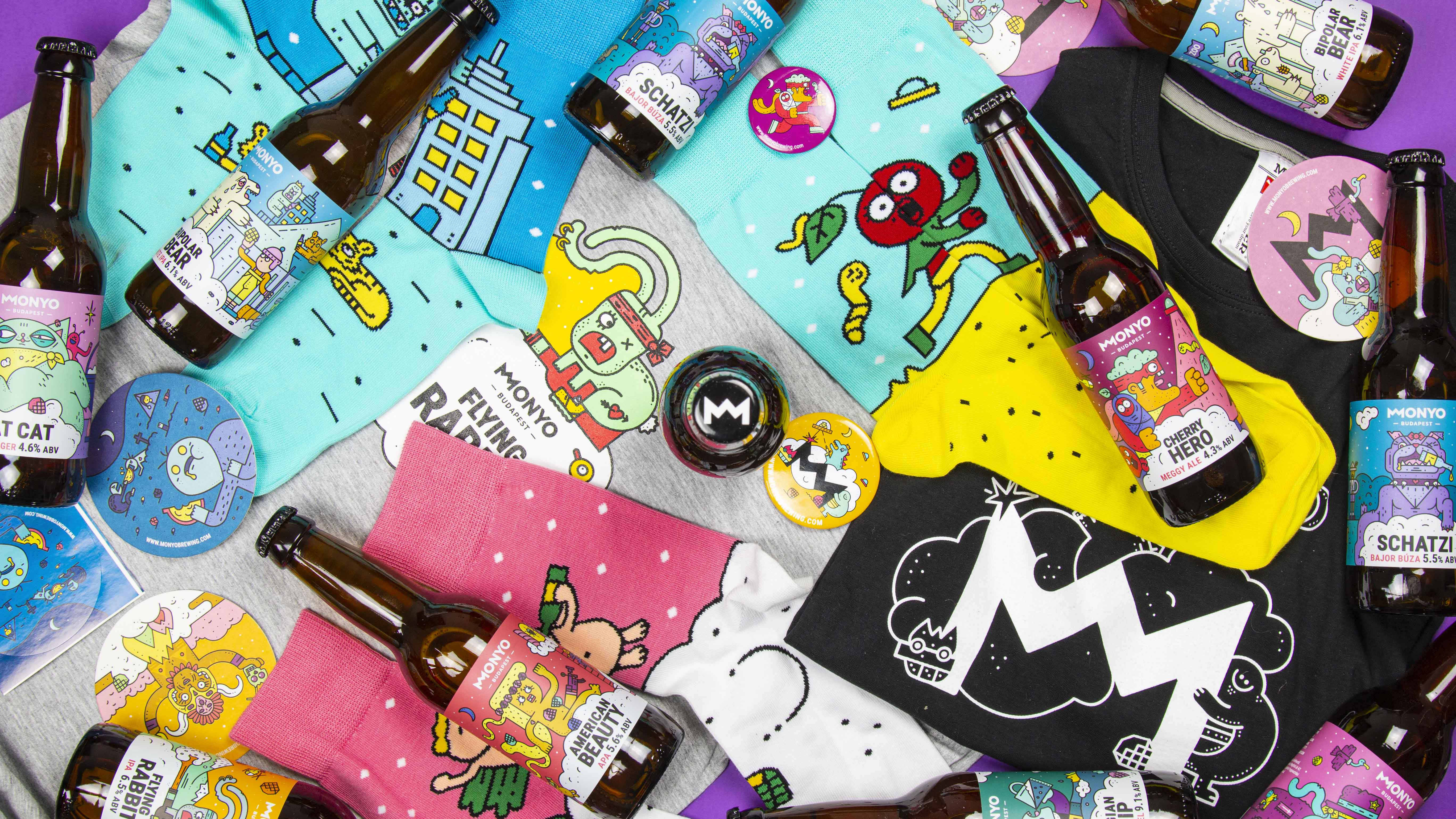 Woman in blue hat and sweater sitting on couch with laptop.