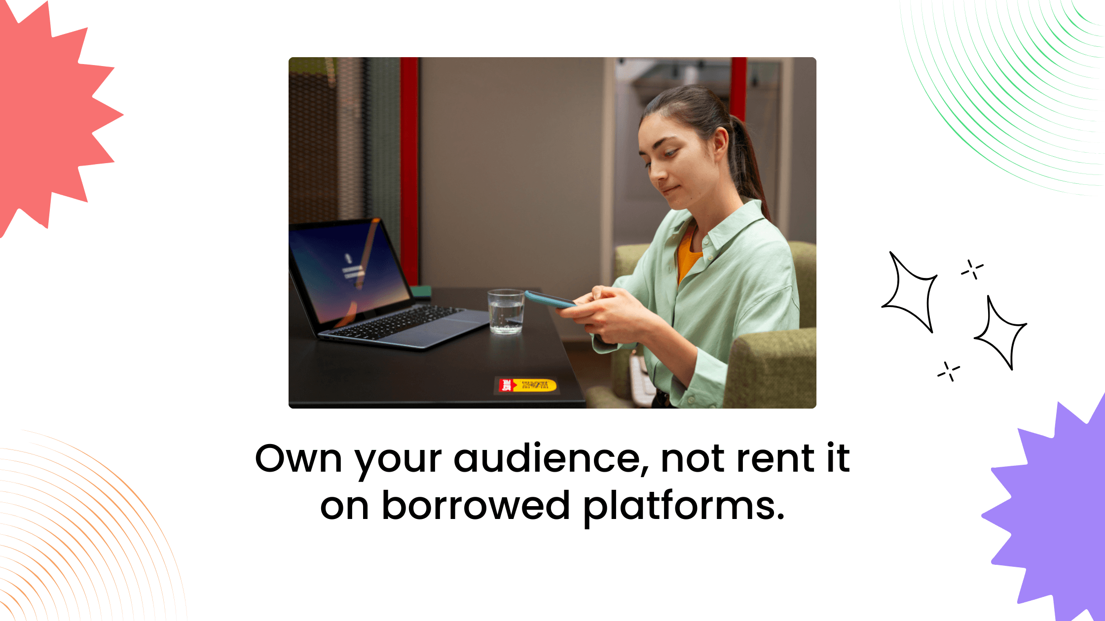 Coach working on laptop and phone, emphasizing owning your audience through a branded hub instead of relying on third-party platforms.