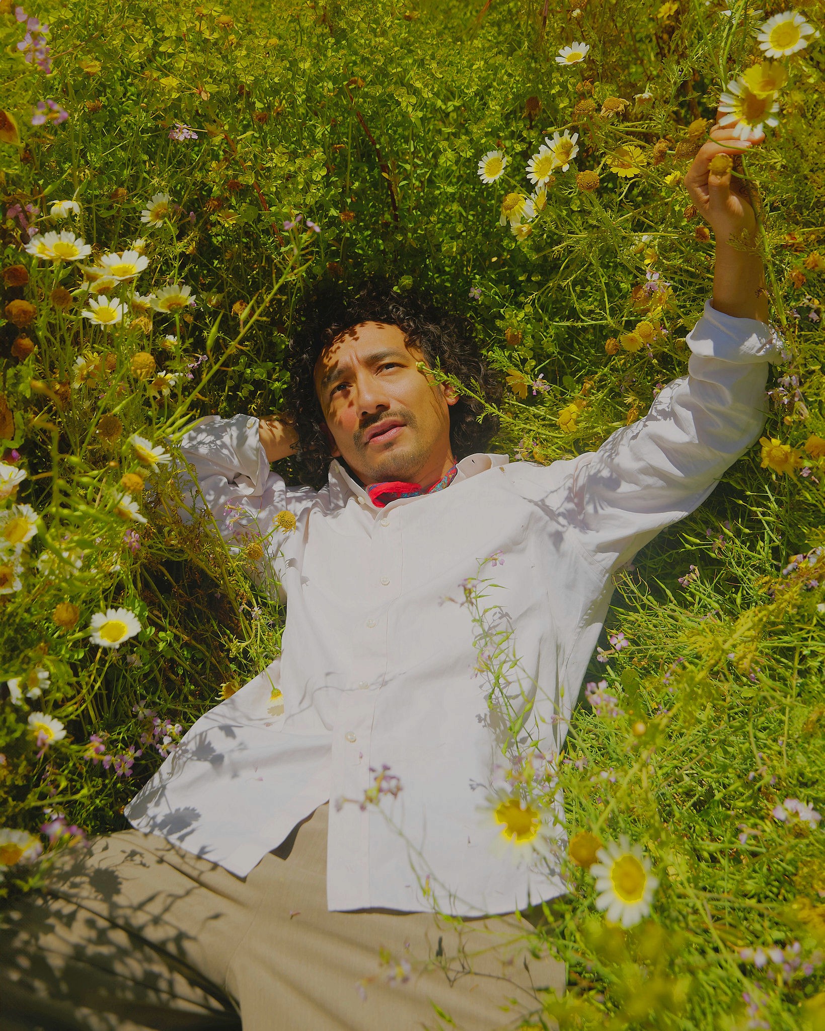 Woman with red hair covering mouth with hair