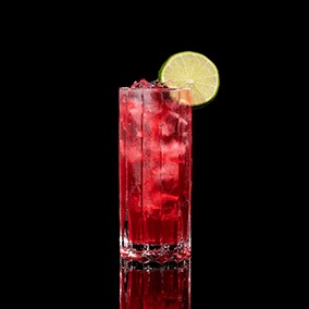 A closeup of a Sea Breeze drink against a dark background.