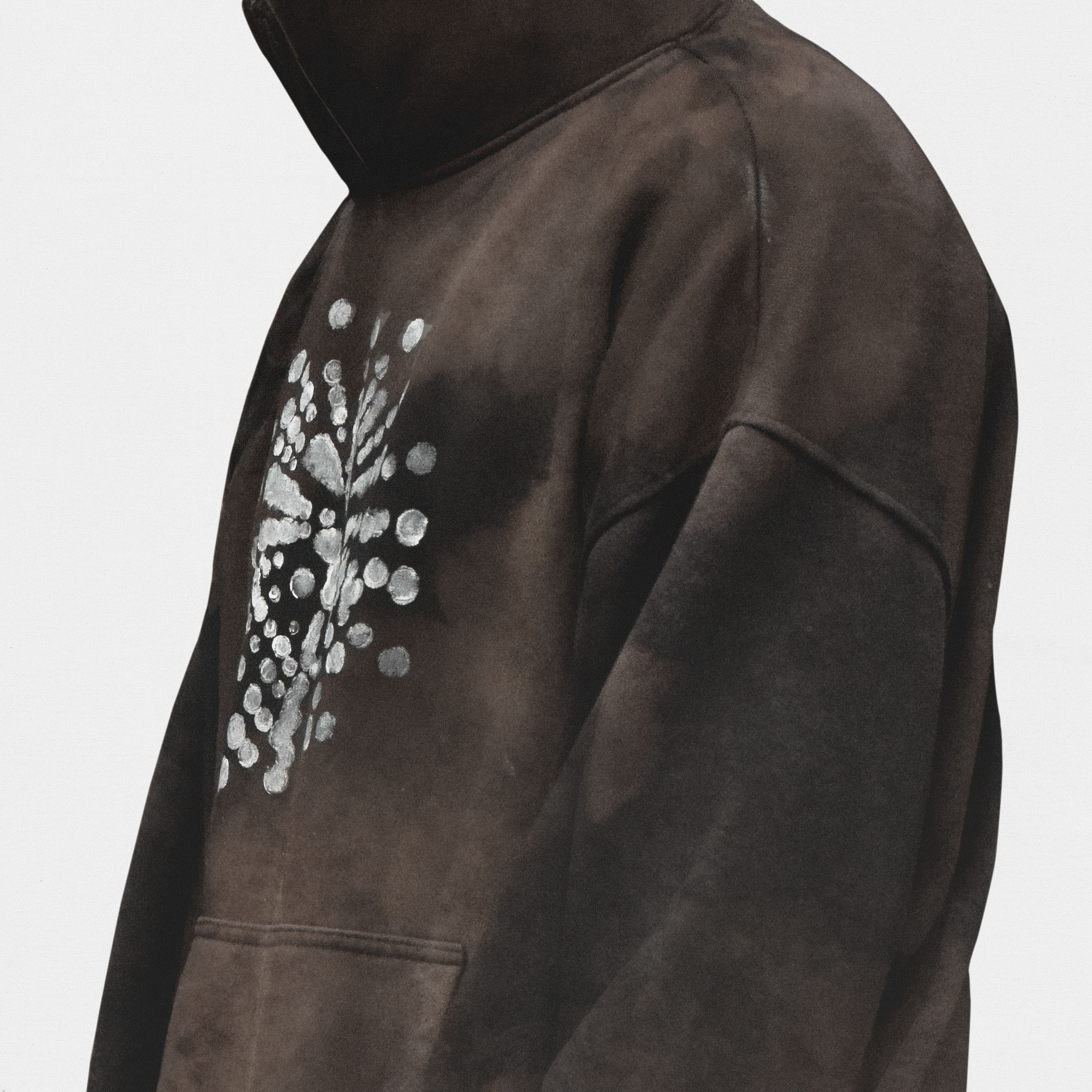 Close up on model wearing brown hoodie, white background