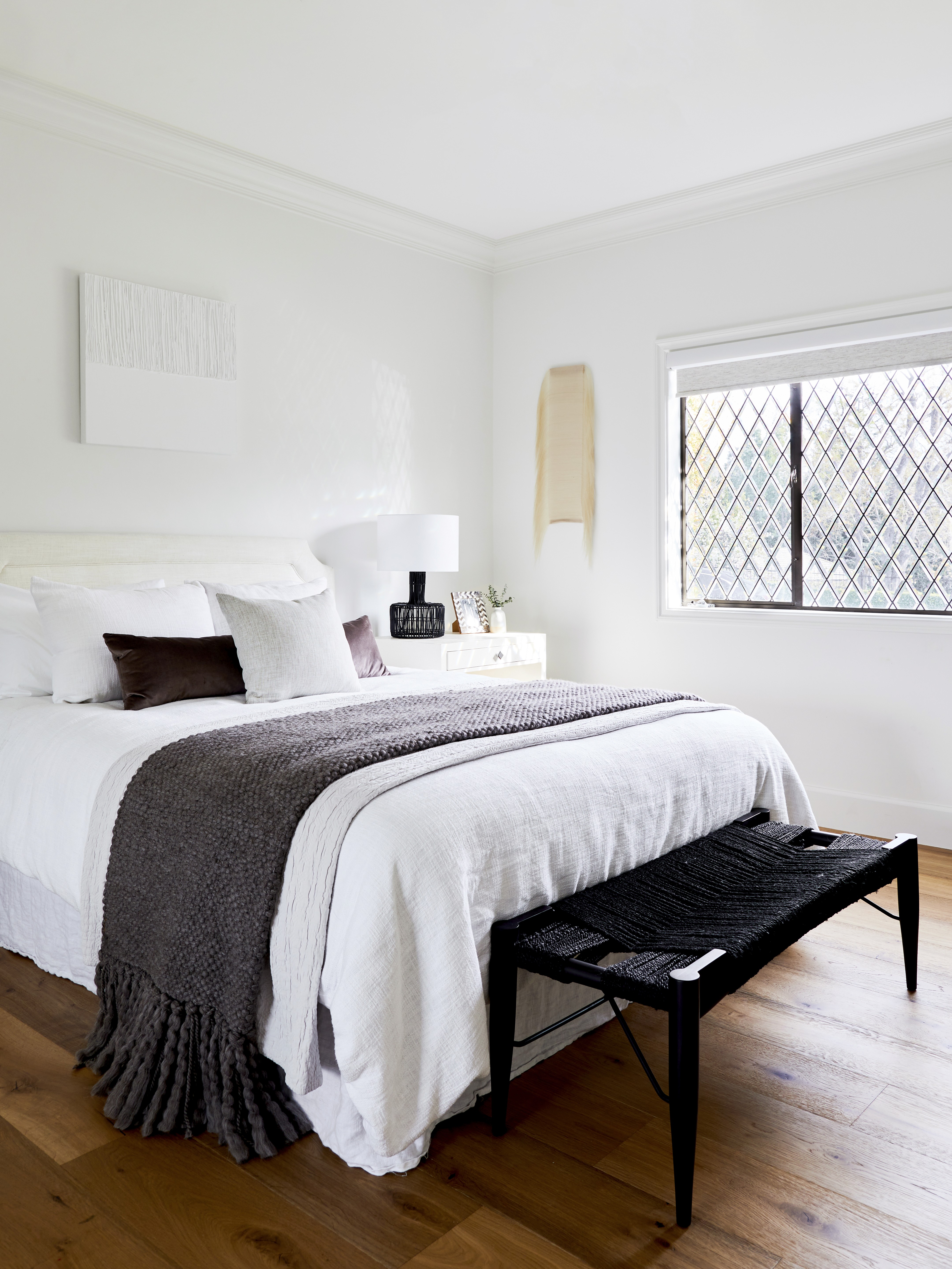 Stacked brick staircase ascending to an elegant glass door entry