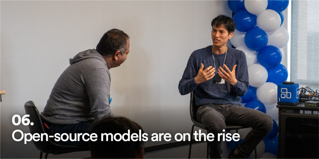 People at Generative AI Unconference with the text "open-source models are on the rise"