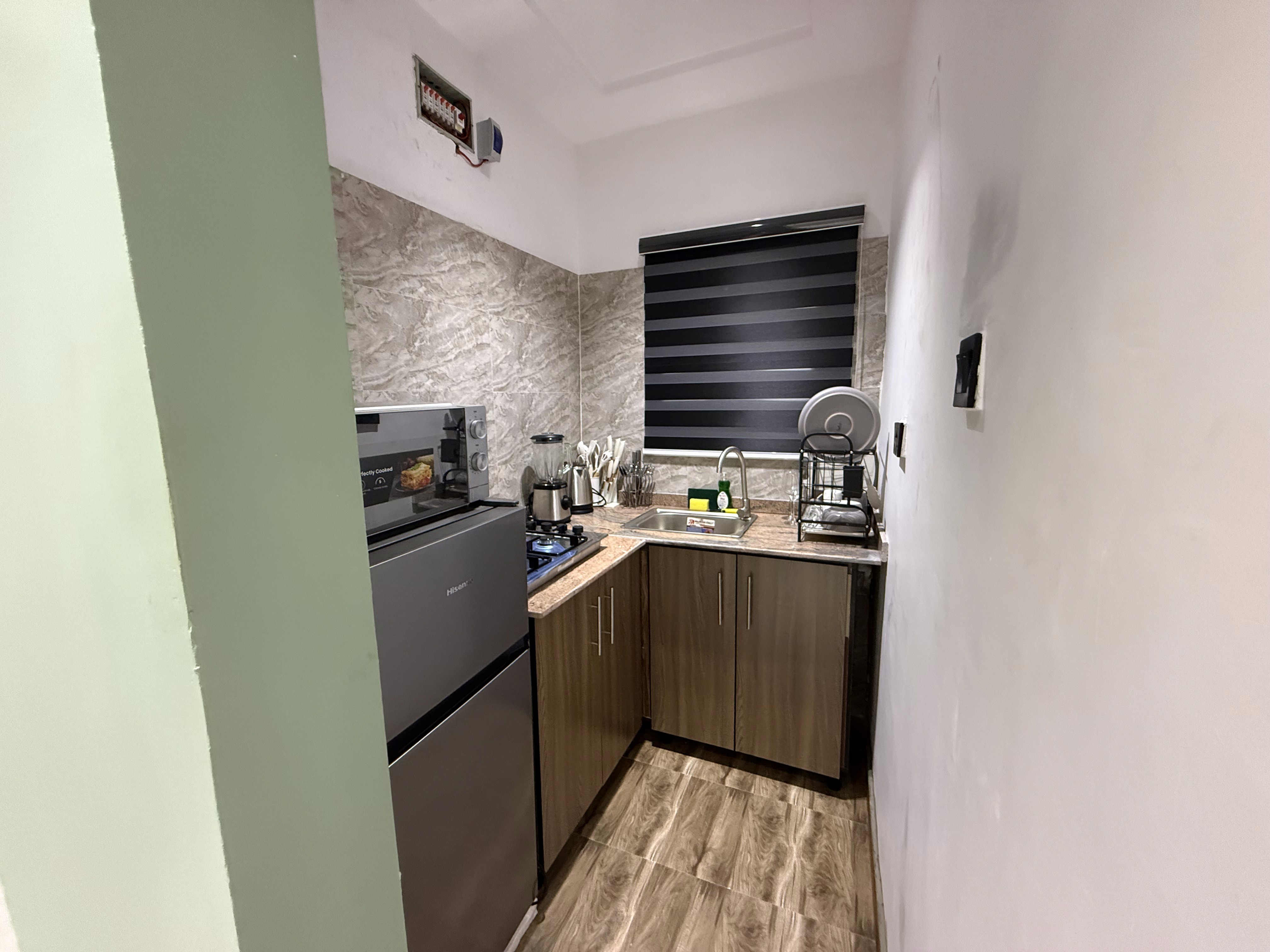 Fully equipped kitchenette at Olive The Crest, shortlet apartment in Yaba, Lagos