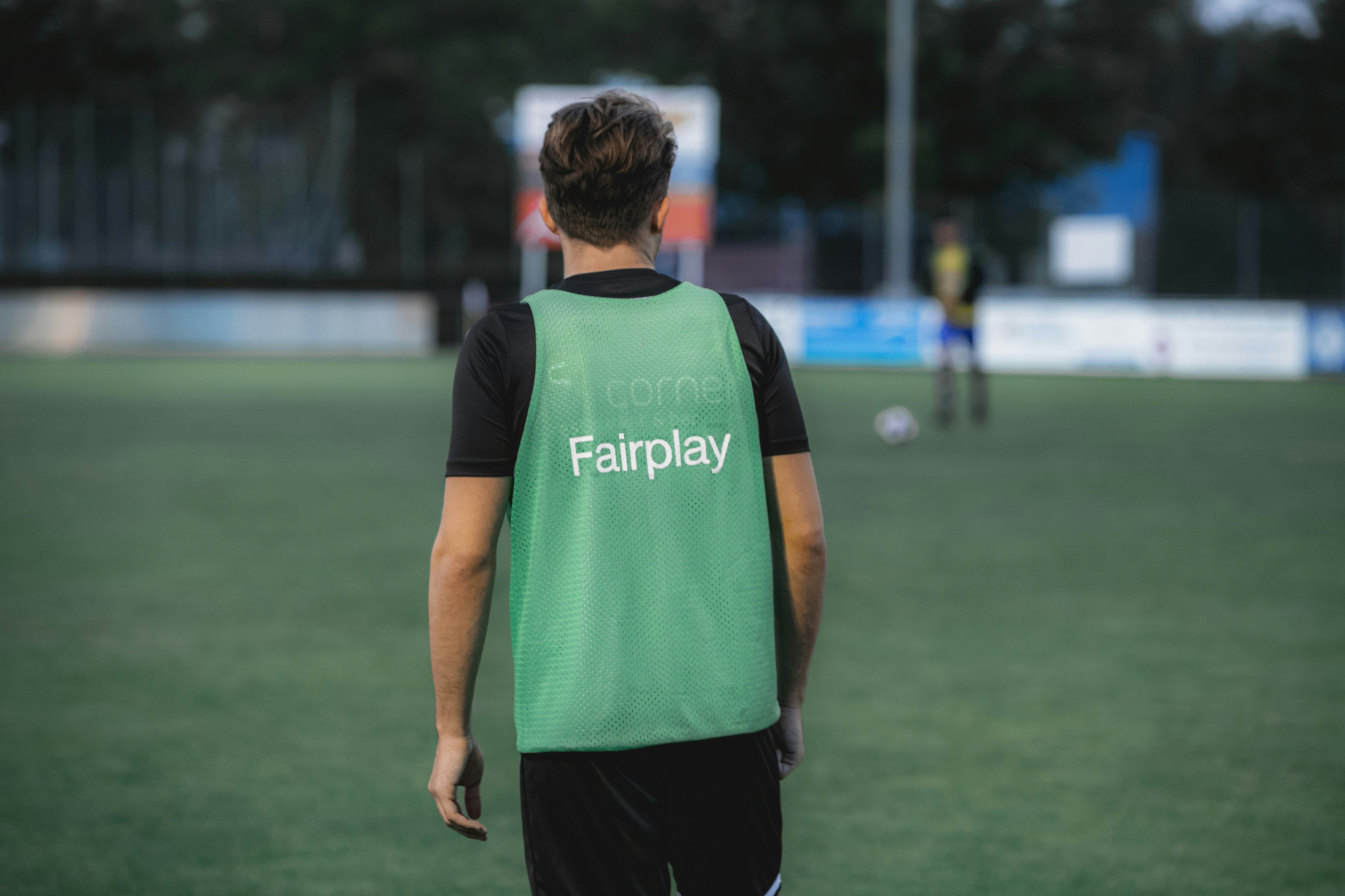 Person playing soccer looks into distance