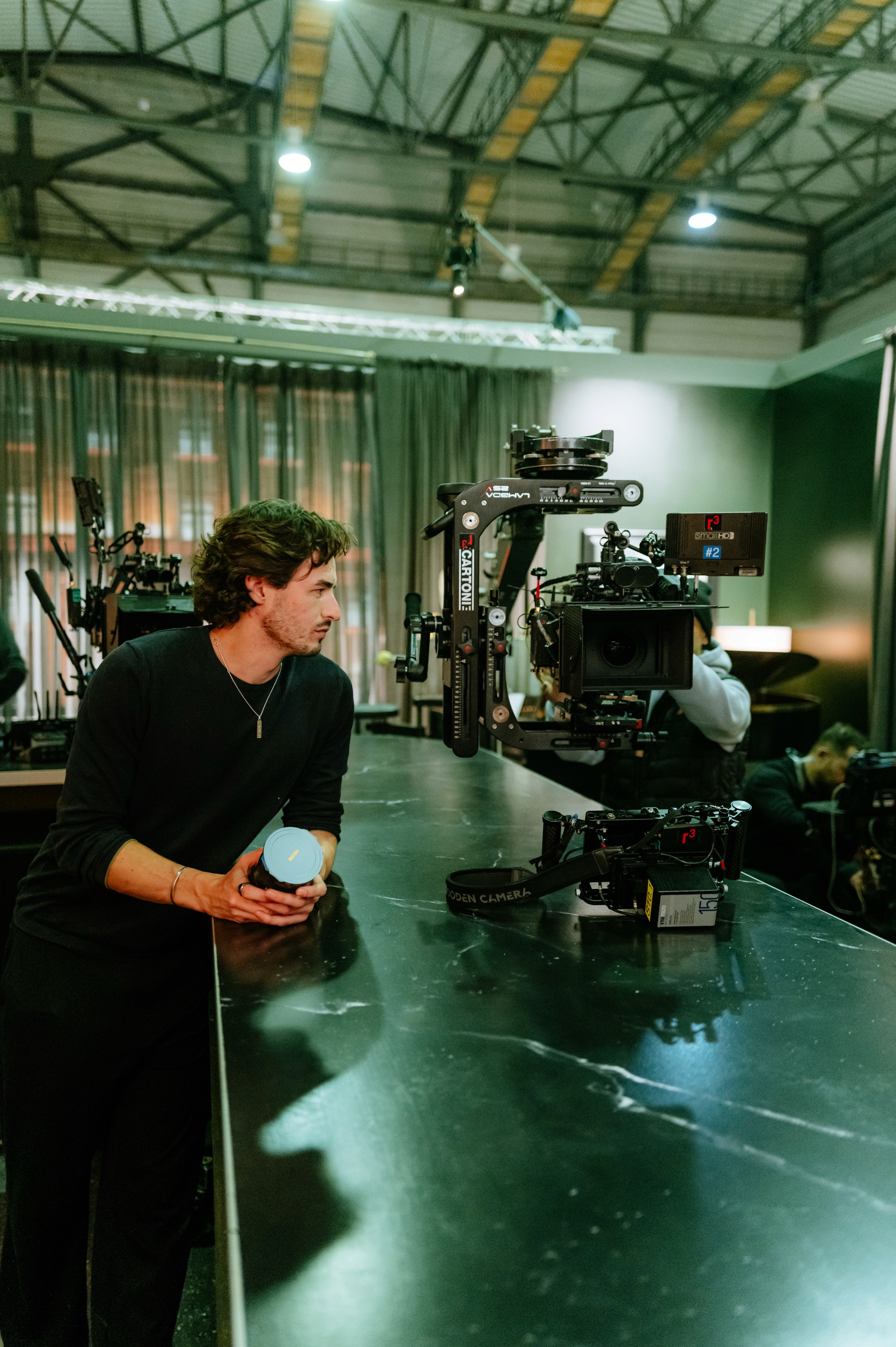 Person in a white off-shoulder top using a MacBook laptop, with text overlay 'What's new in digital?' and the fabrica® logo in the top corner.