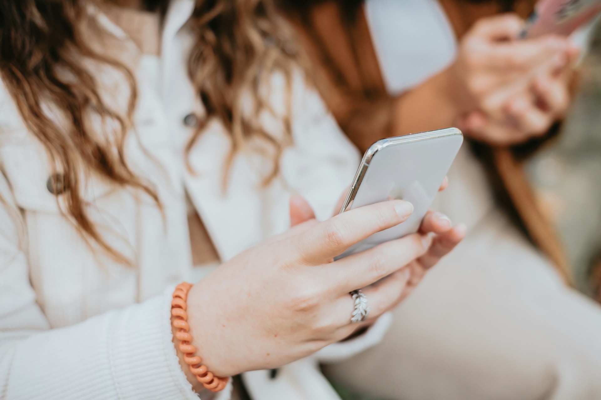 A woman holding a phone