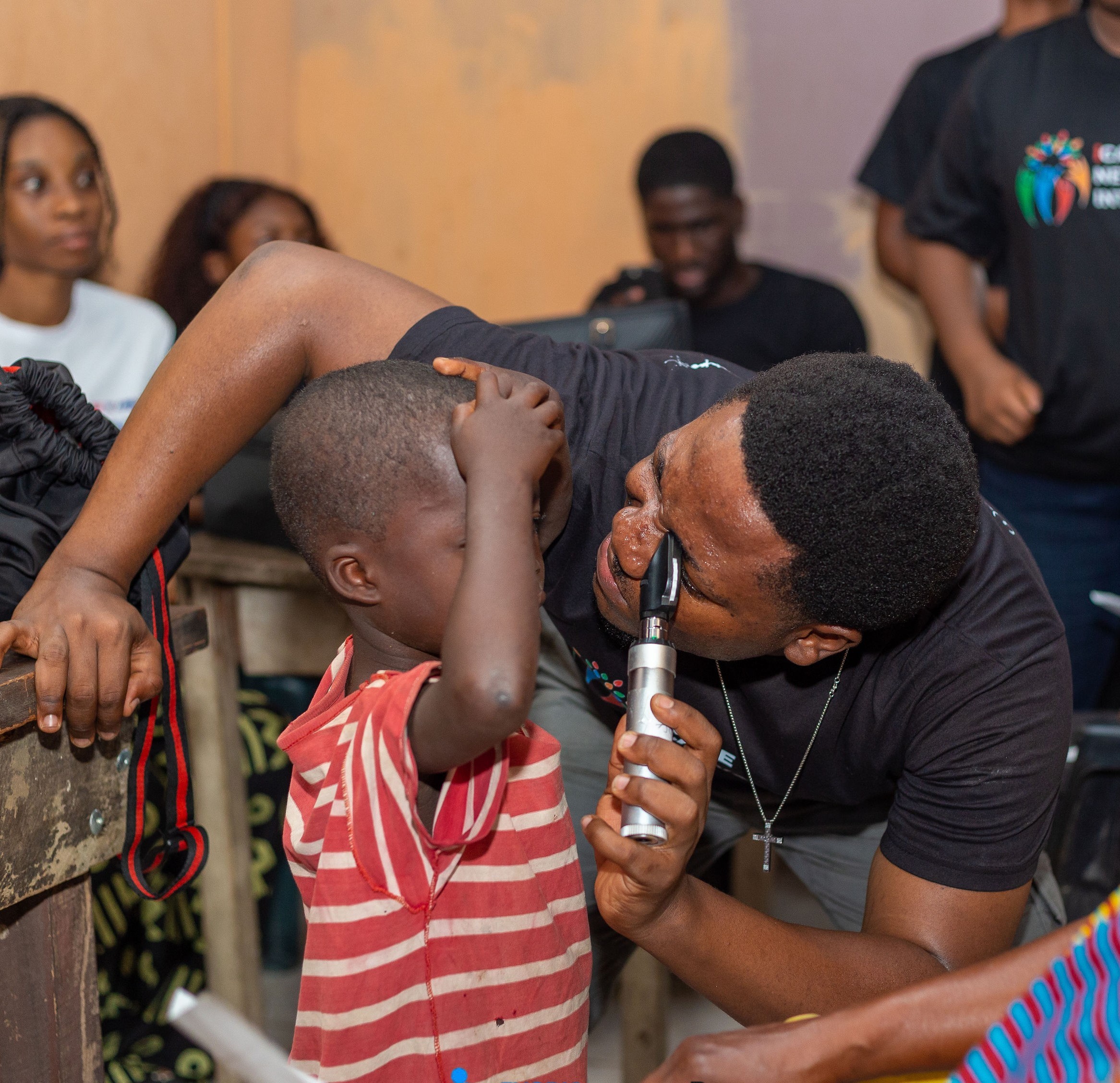 a man cutting a woman's hair with a pair of scissors