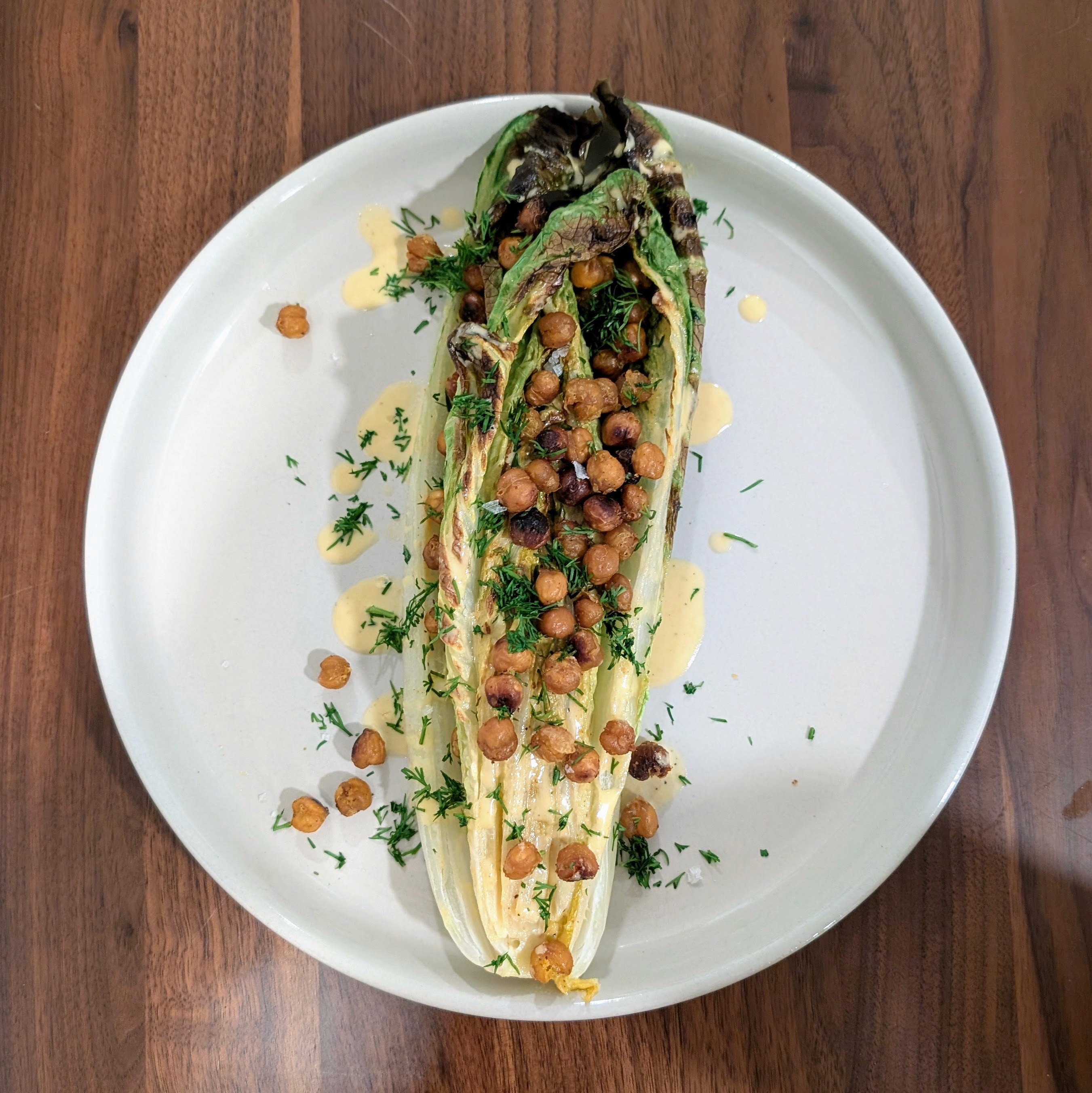 A charred romaine heart salad with crispy chickpeas, and homemade dressing. She's beautiful!