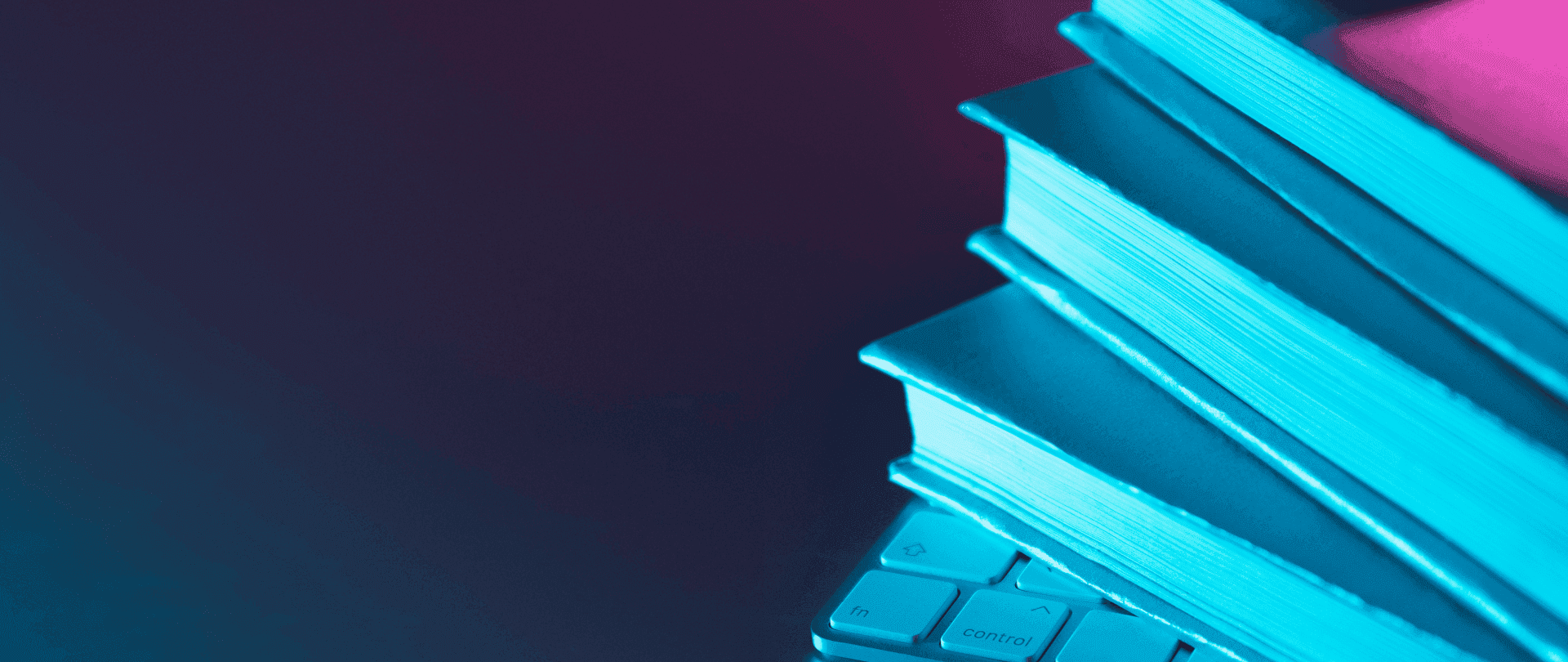 Stack of thick reference books glowing in blue light beside a keyboard, representing the foundational concepts and detailed insights covered in Part 1 of the watchlist management guide.