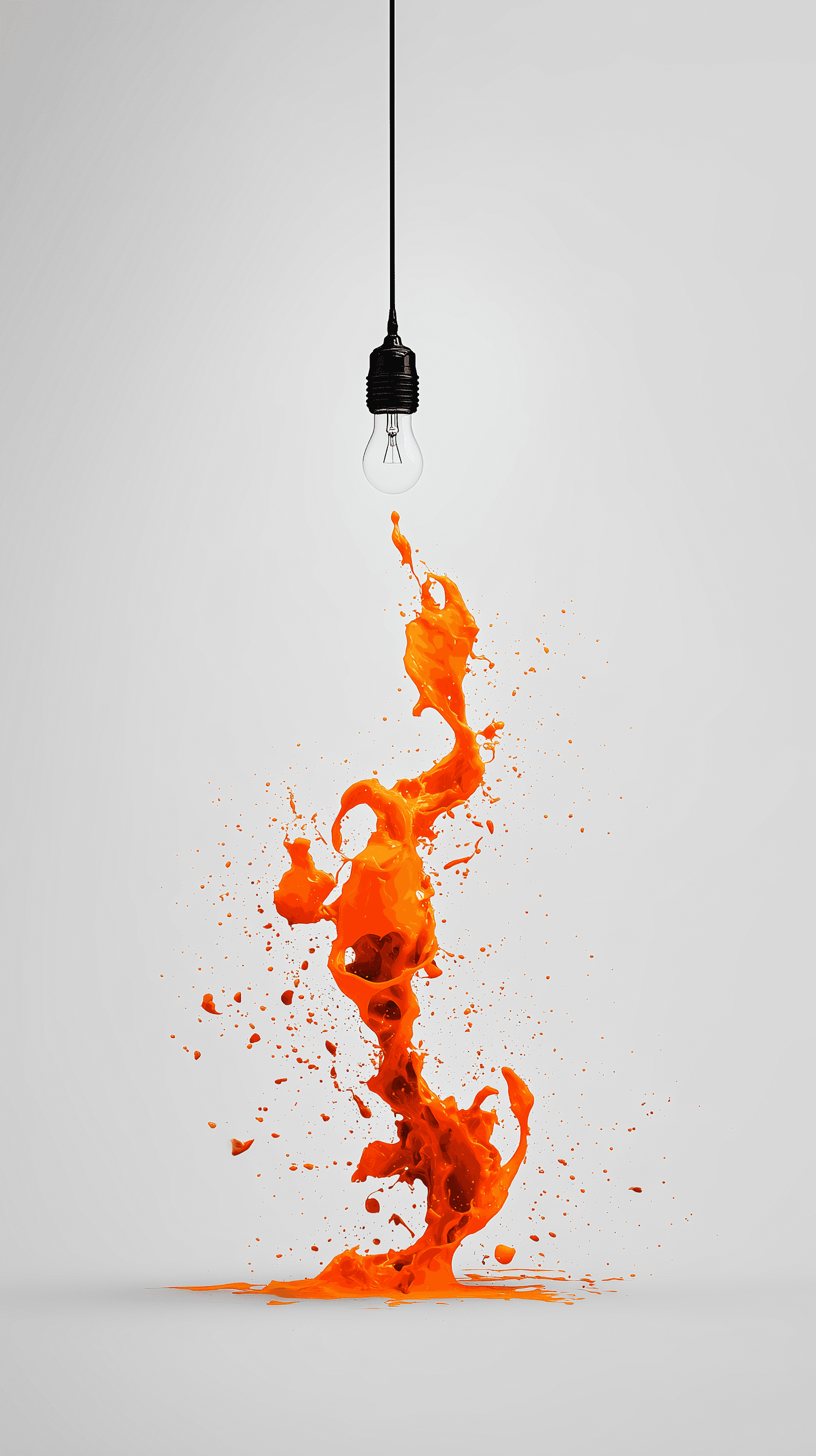 Bright idea concept with orange paint splash under a lightbulb, representing creative thinking and bold visual design by Sleeklabs