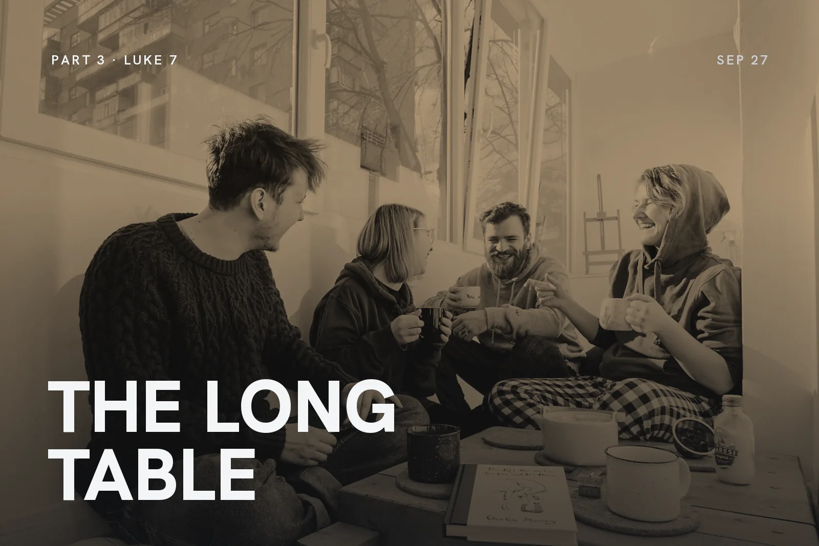 Series artwork for The Long Table: four friends laughing over tea on a living room floor