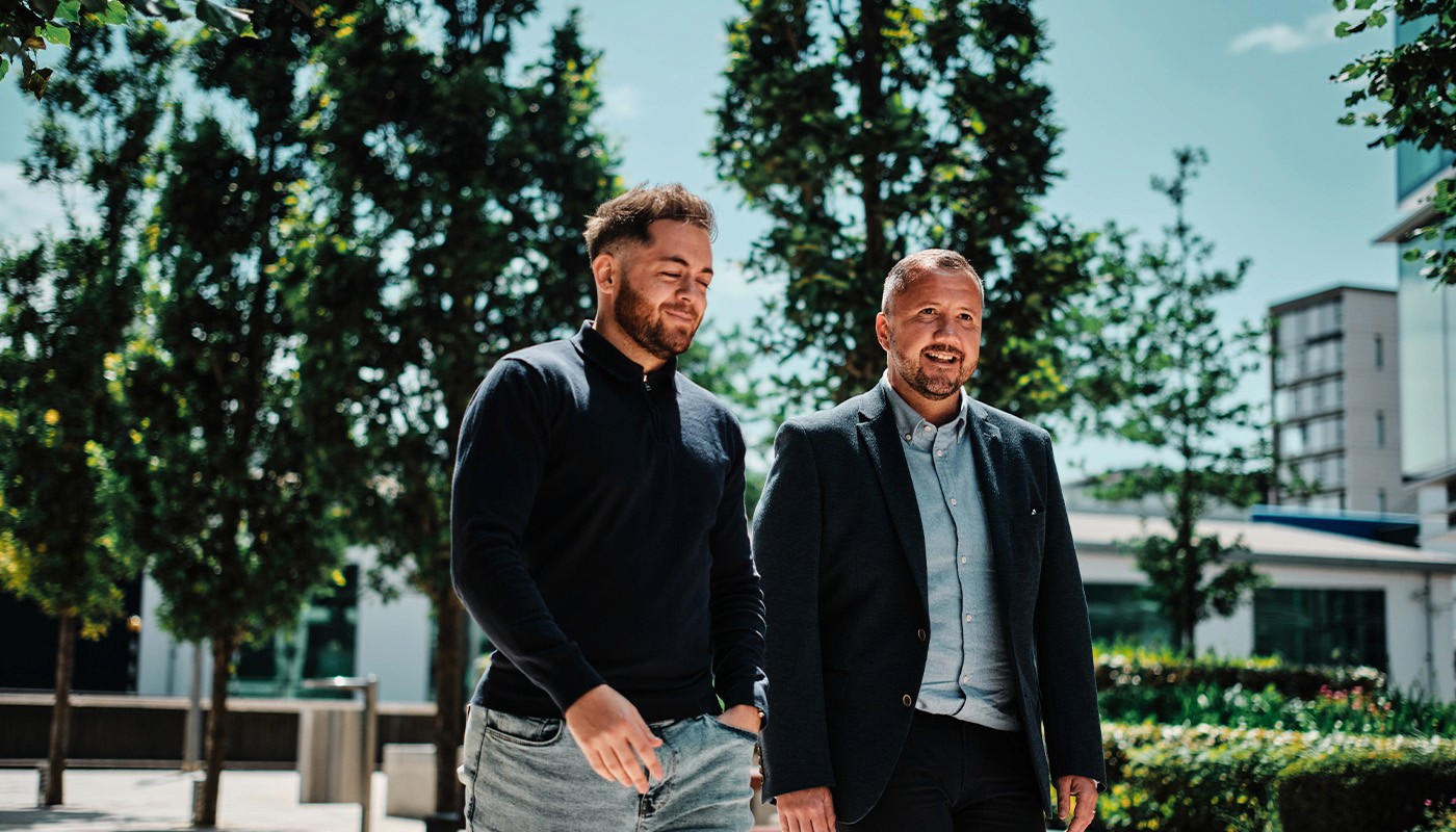 Sceneic shot of YOONO employees talking and walking