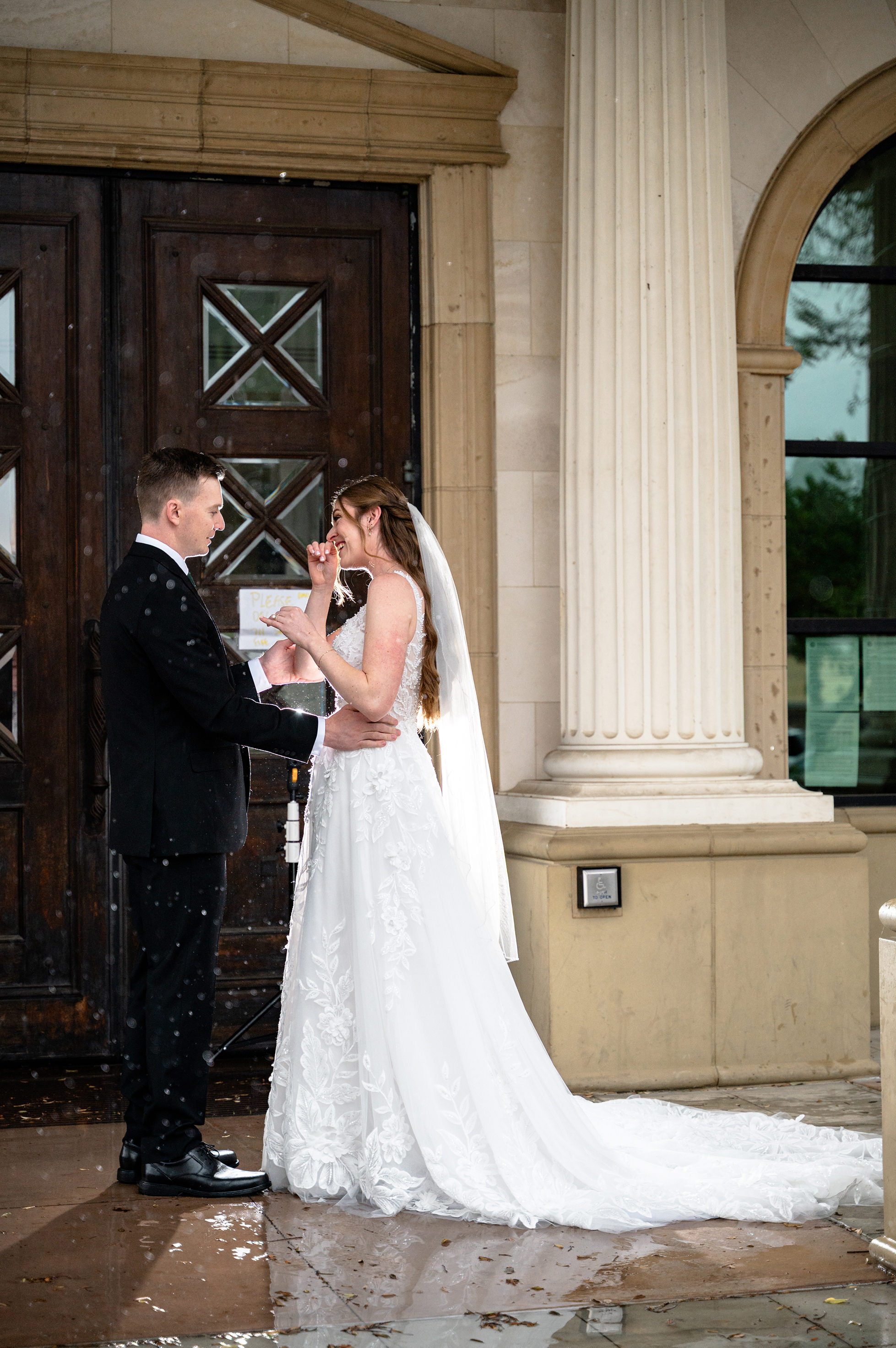 Flat lay wedding details with bouquet, rings, and sparkling bridal heels