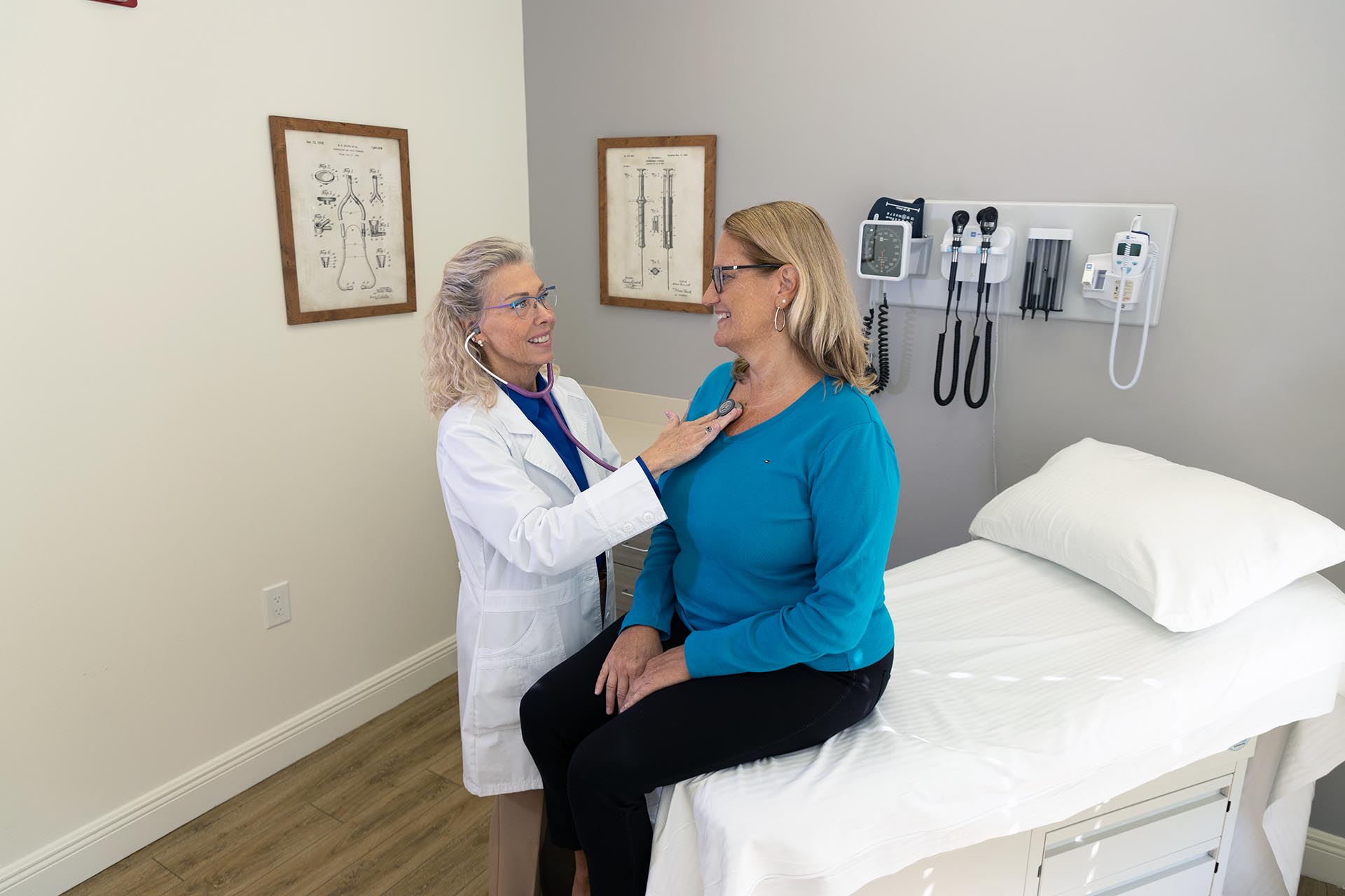 Dr. Karen Larson conducting a primary care exam with a Harper Health member.