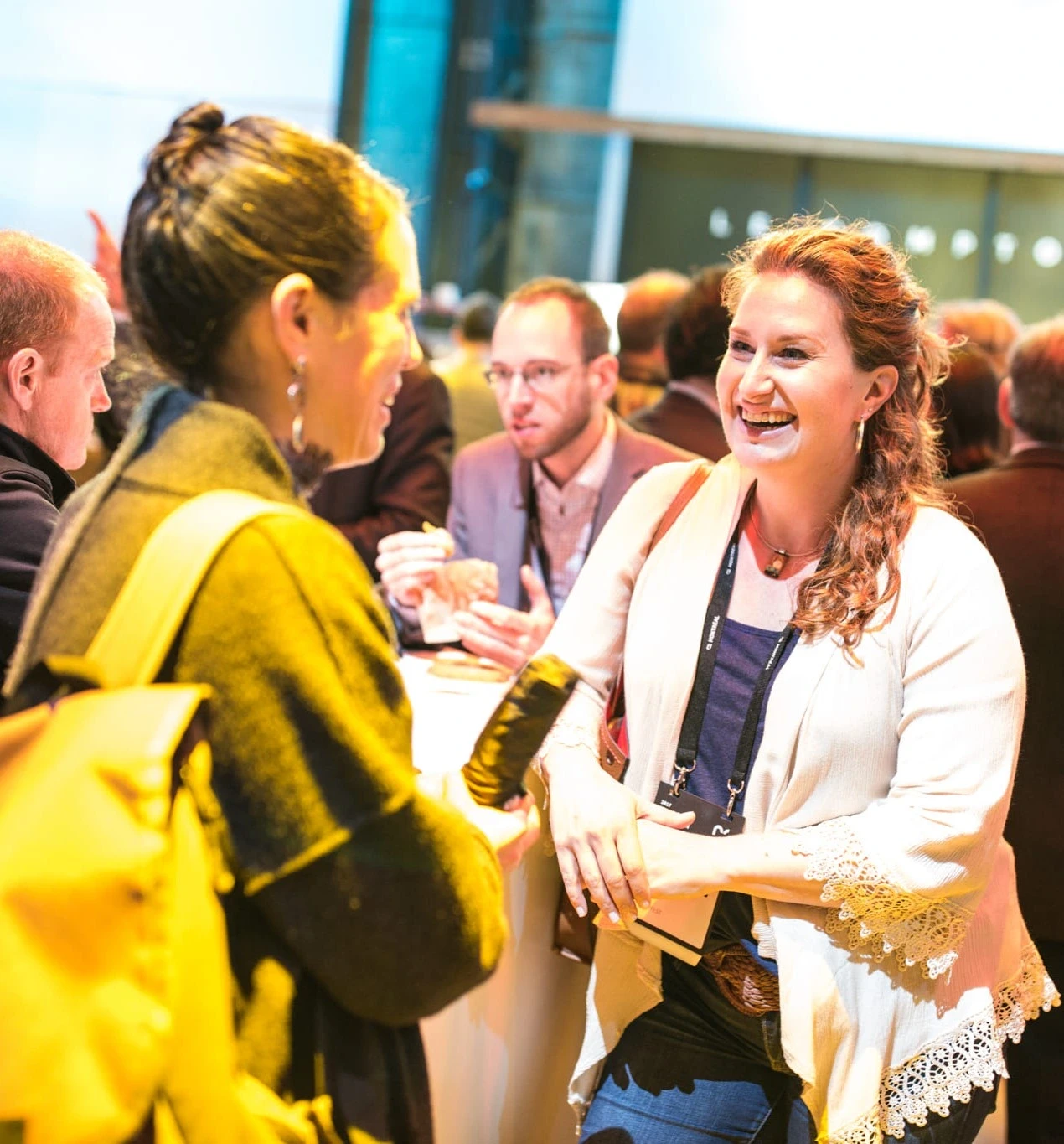 Participants engaging in a collaborative workshop at C2, exchanging ideas and working together in an interactive session.