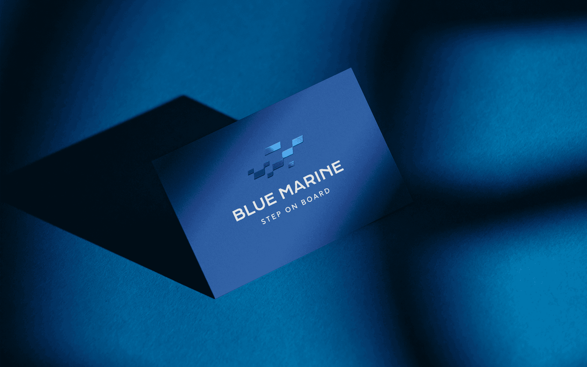 Business card design for Blue Marine, using a deep blue palette and clean lines that reflect the brand’s marine identity