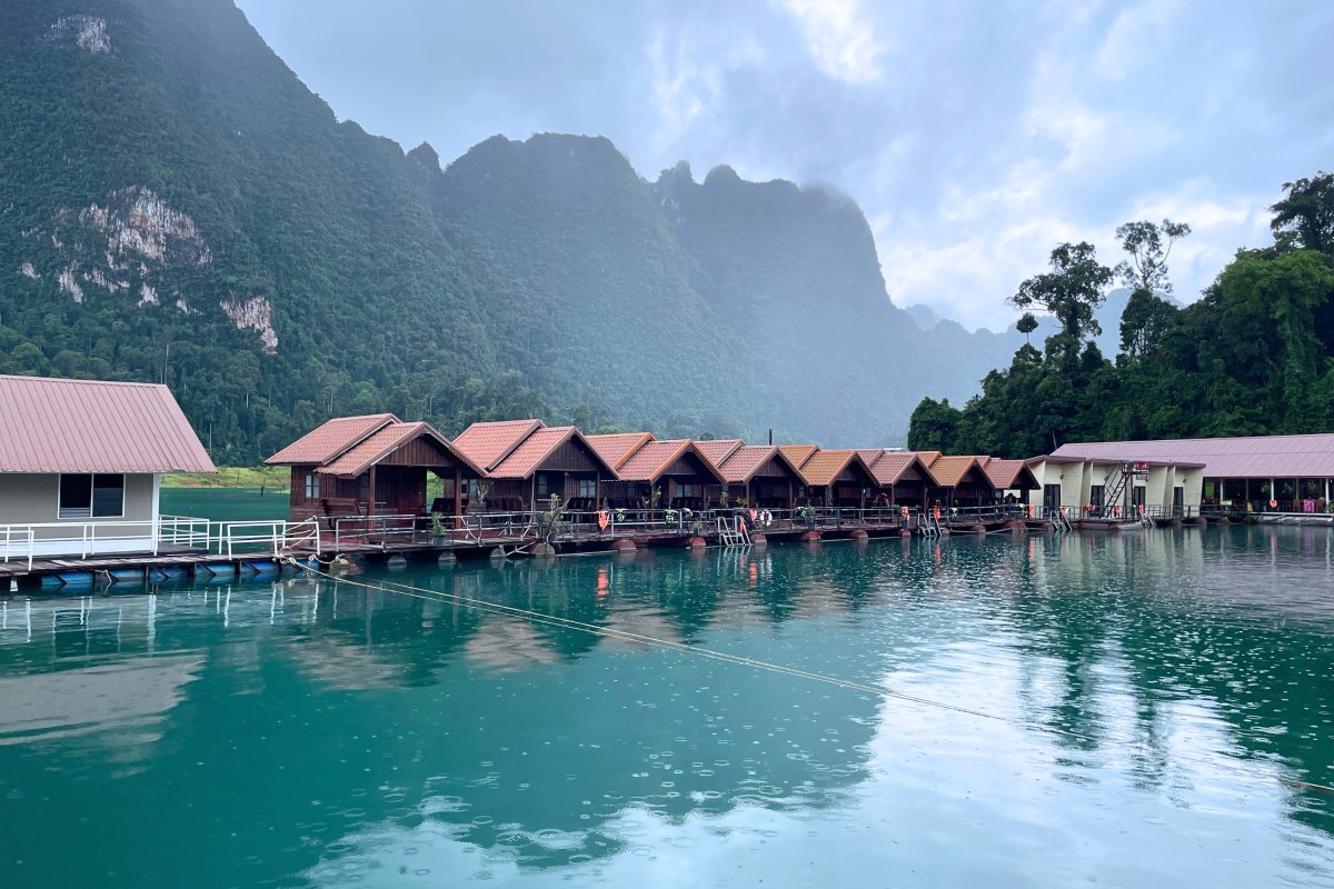 brown and white temple surrounded by green trees during daytime