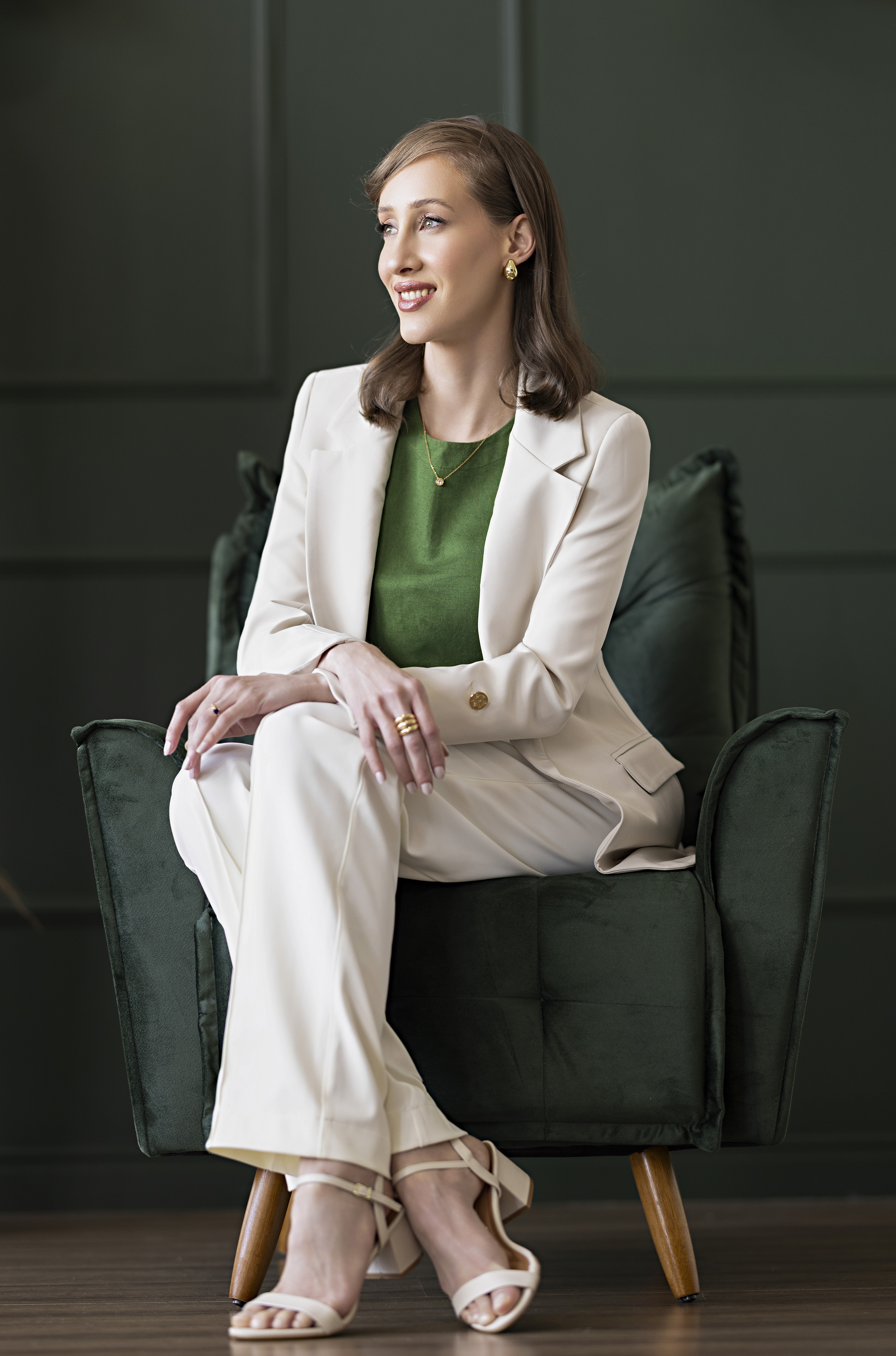 Smiling female therapist , surrounded by a cozy background.