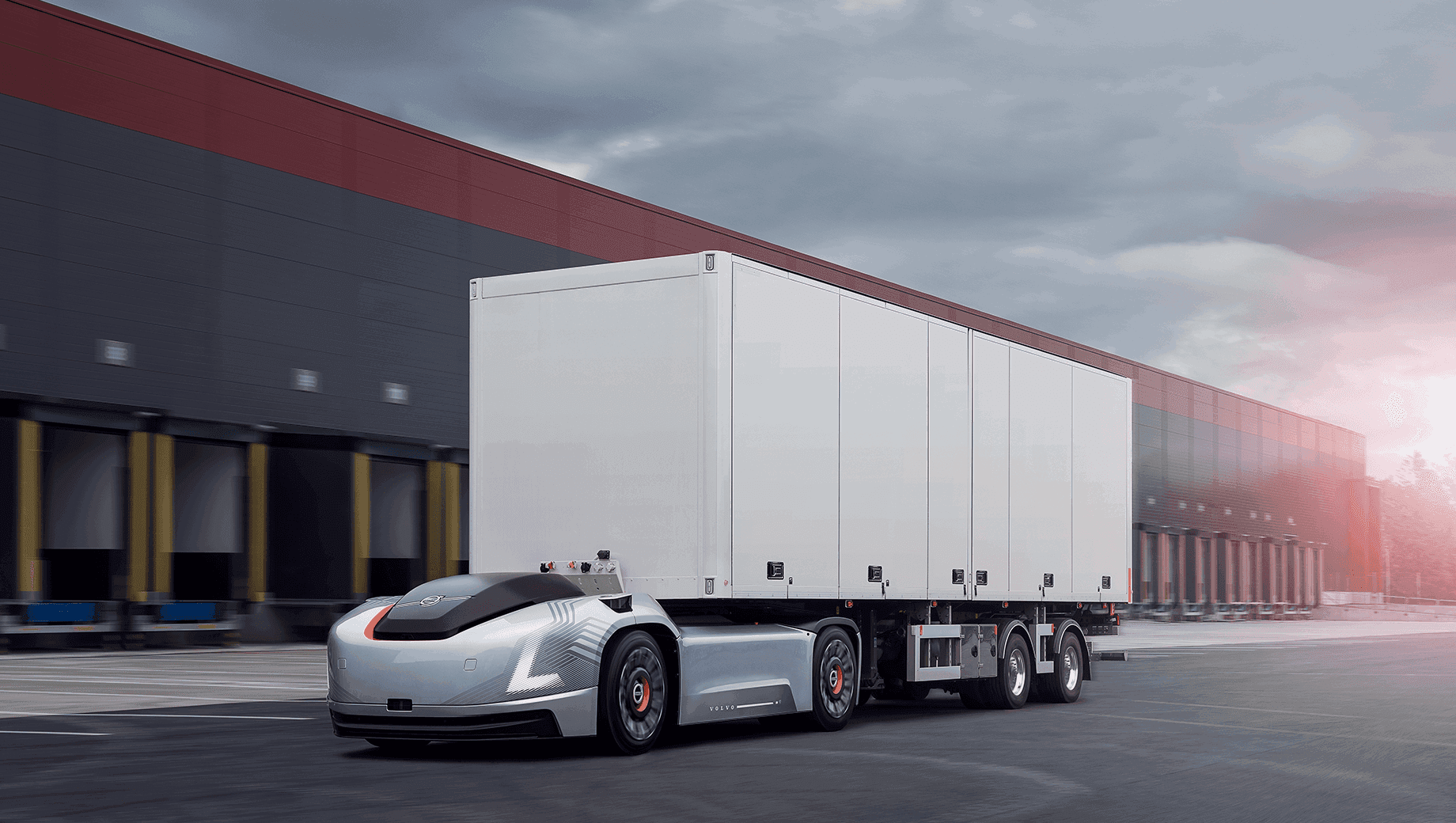 A professional shot of an autonomous truck on a German highway, ideally showing the road and surrounding landscape for context.