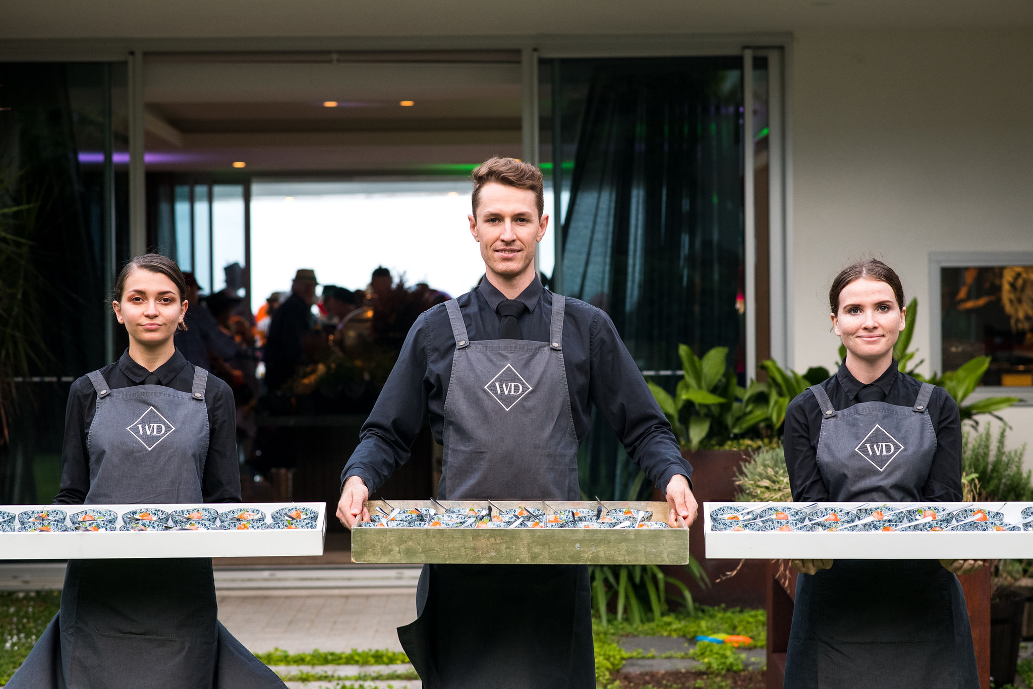 Wait staff holding canape trays