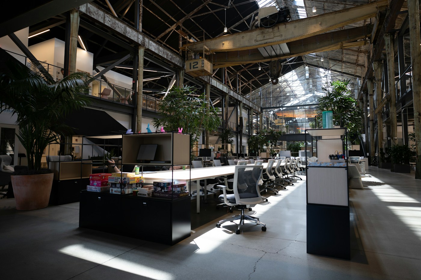 open plan design studio with empty desks in late afternoon light