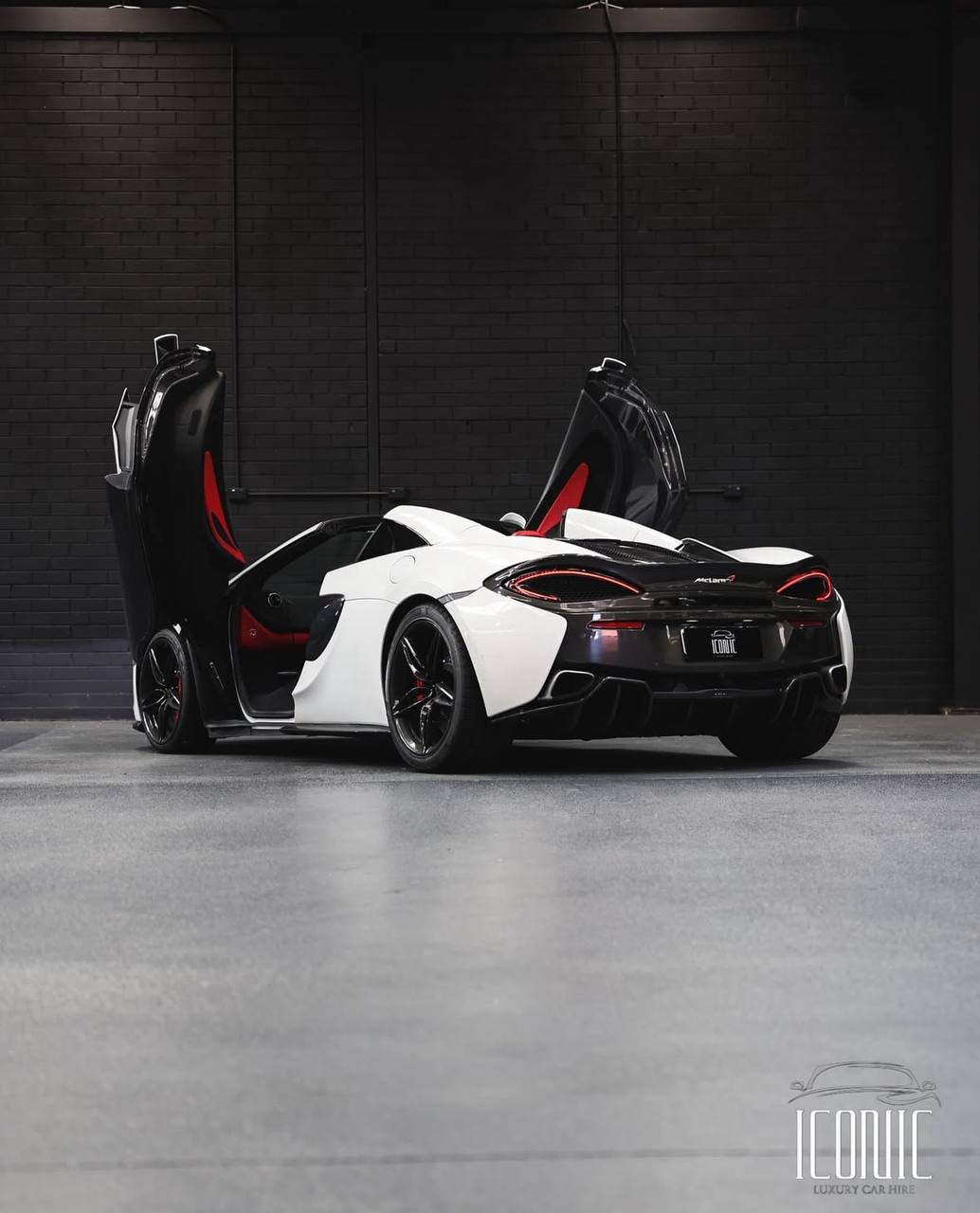 Rear view of a sleek sportscar, ideal for highlighting car rental style and design