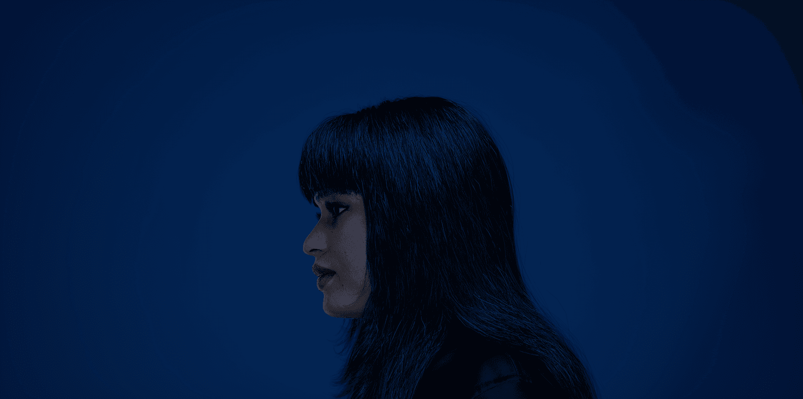 Close-up of white fur with black heart-shaped spots—soft, high-contrast texture for fashion/home décor.