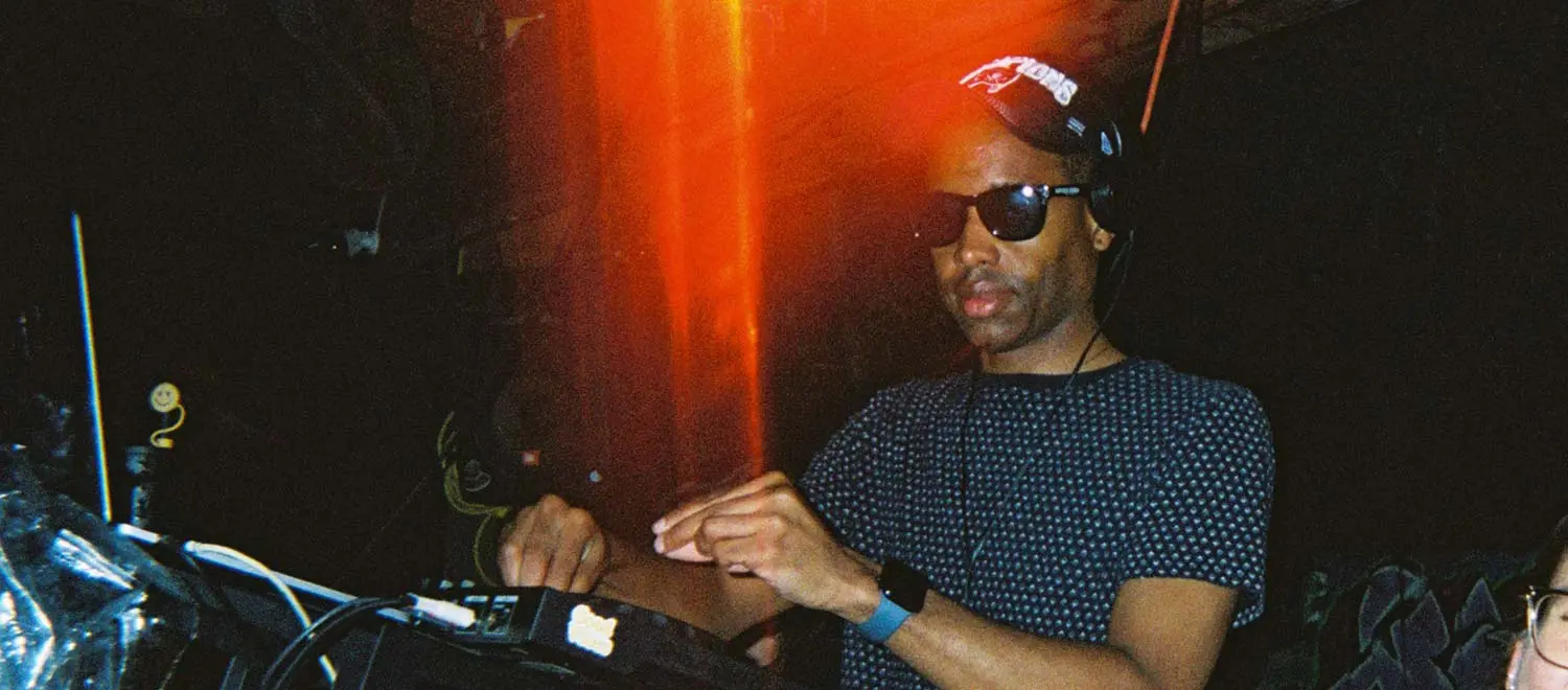 Musician performing an acoustic set on a small, intimate stage