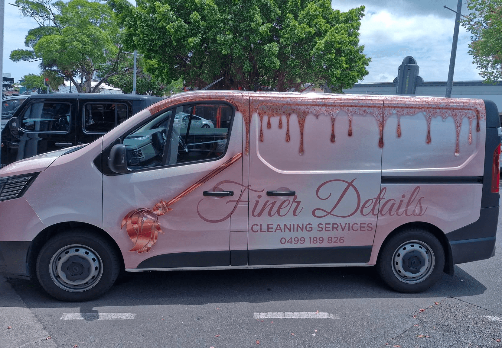 Woman in yellow gloves cleaning a table
