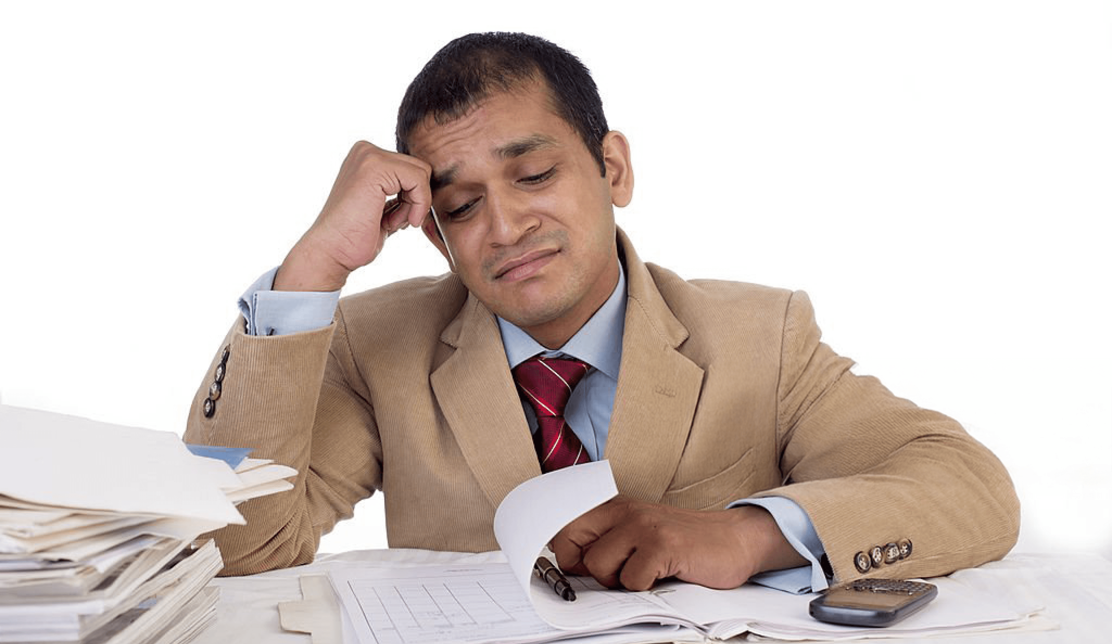 Frustrated businessman surrounded by paperwork, representing workplace stress and overload.