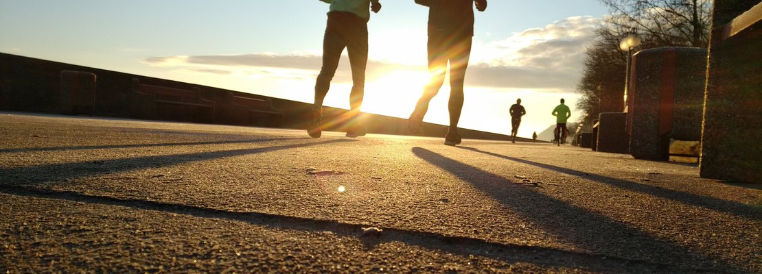 four runners on a path